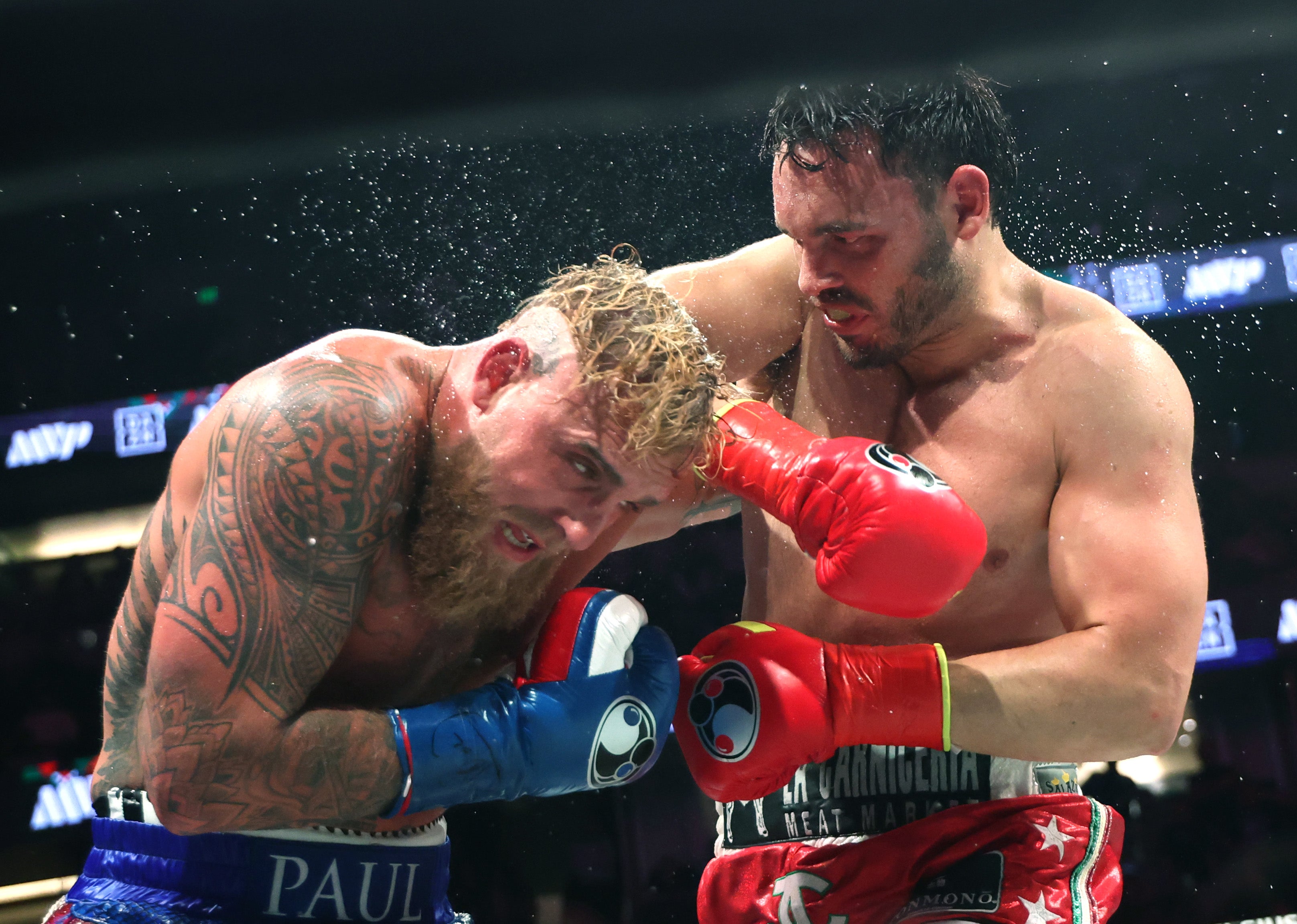 Juli Cesar Chavez Jr. (right) fights Jake Paul in Anaheim, California on Saturday. The Department of Homeland Security says Chavez has since been arrested and is set to be deported