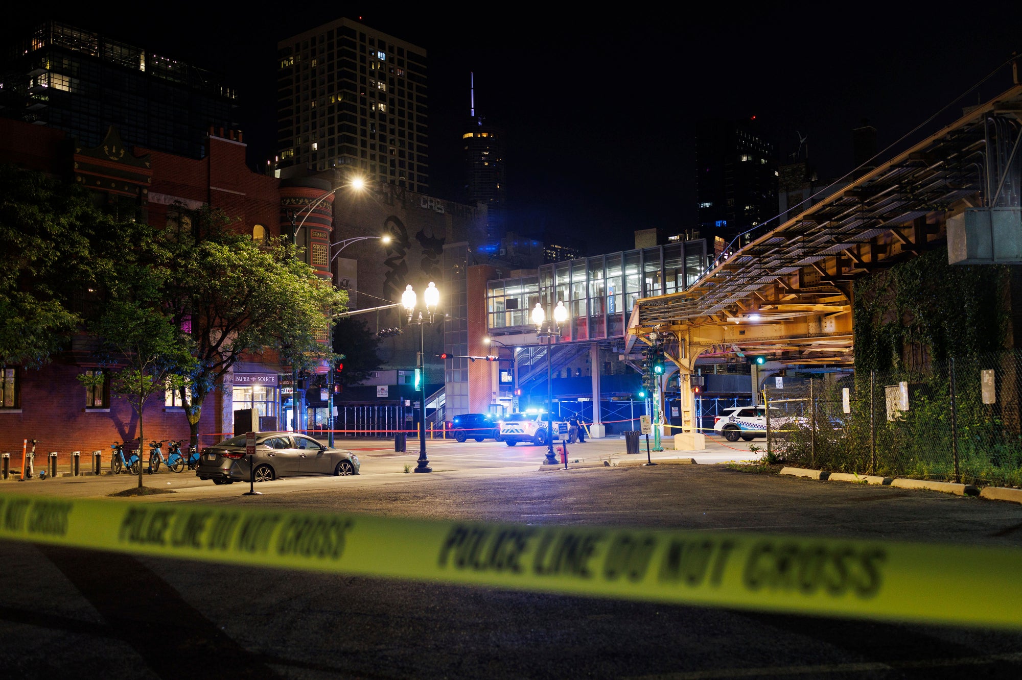 At least four people were killed and 14 others were injured in a drive-by shooting in Chicago Wednesday night, authorities said