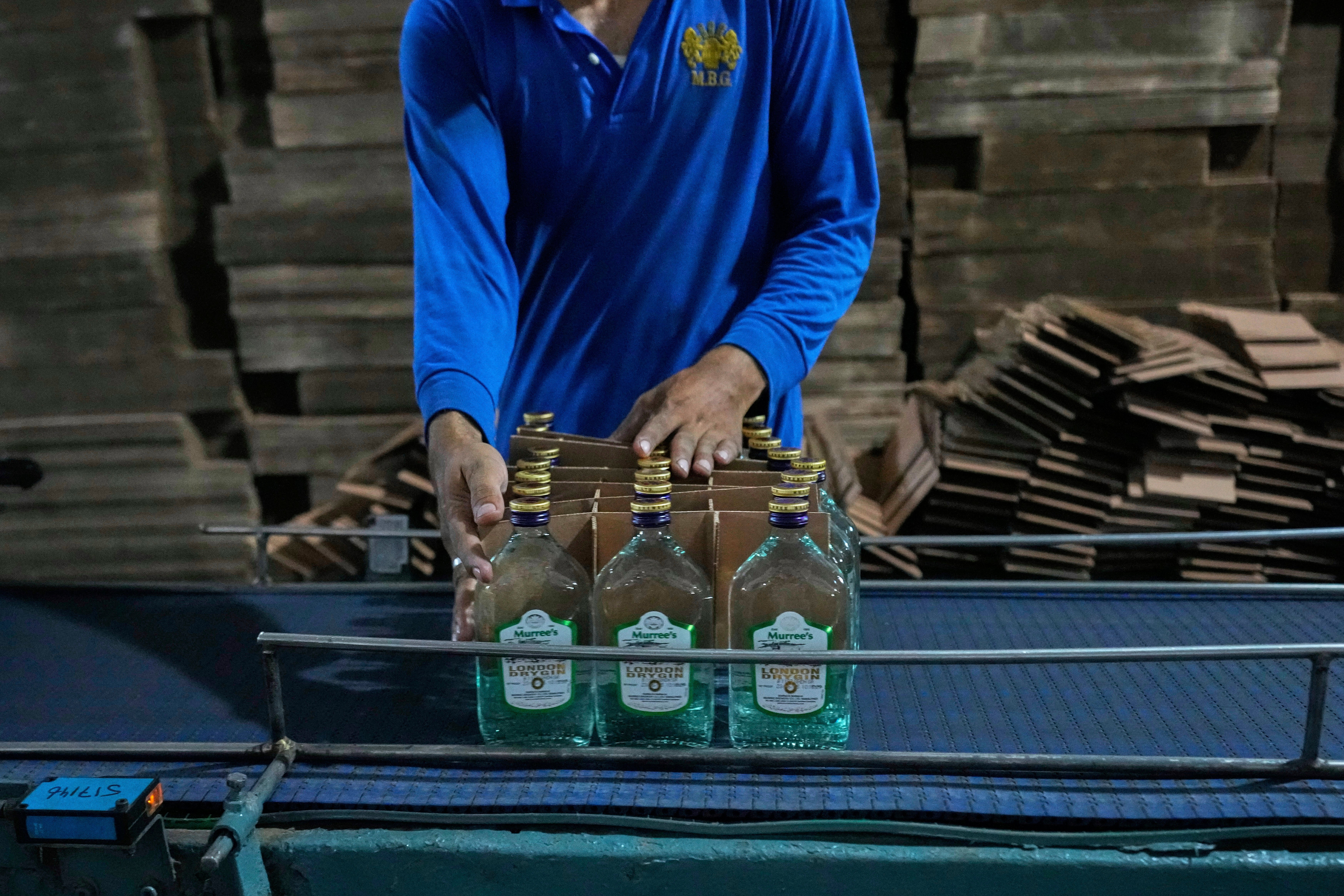 <p>An employee of the Murree Brewery packs liquor bottles at a production unit of the factory, in Rawalpindi, Pakistan, Monday, June 23, 2025. (AP Photo/Anjum Naveed)</p>