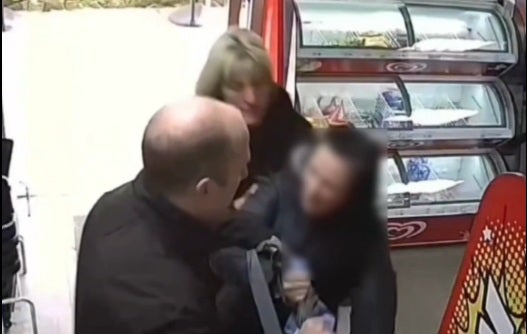 A suspected shoplifter is stopped as she leaves a shop in Durham, a city that has seen a huge increase in offences in recent months