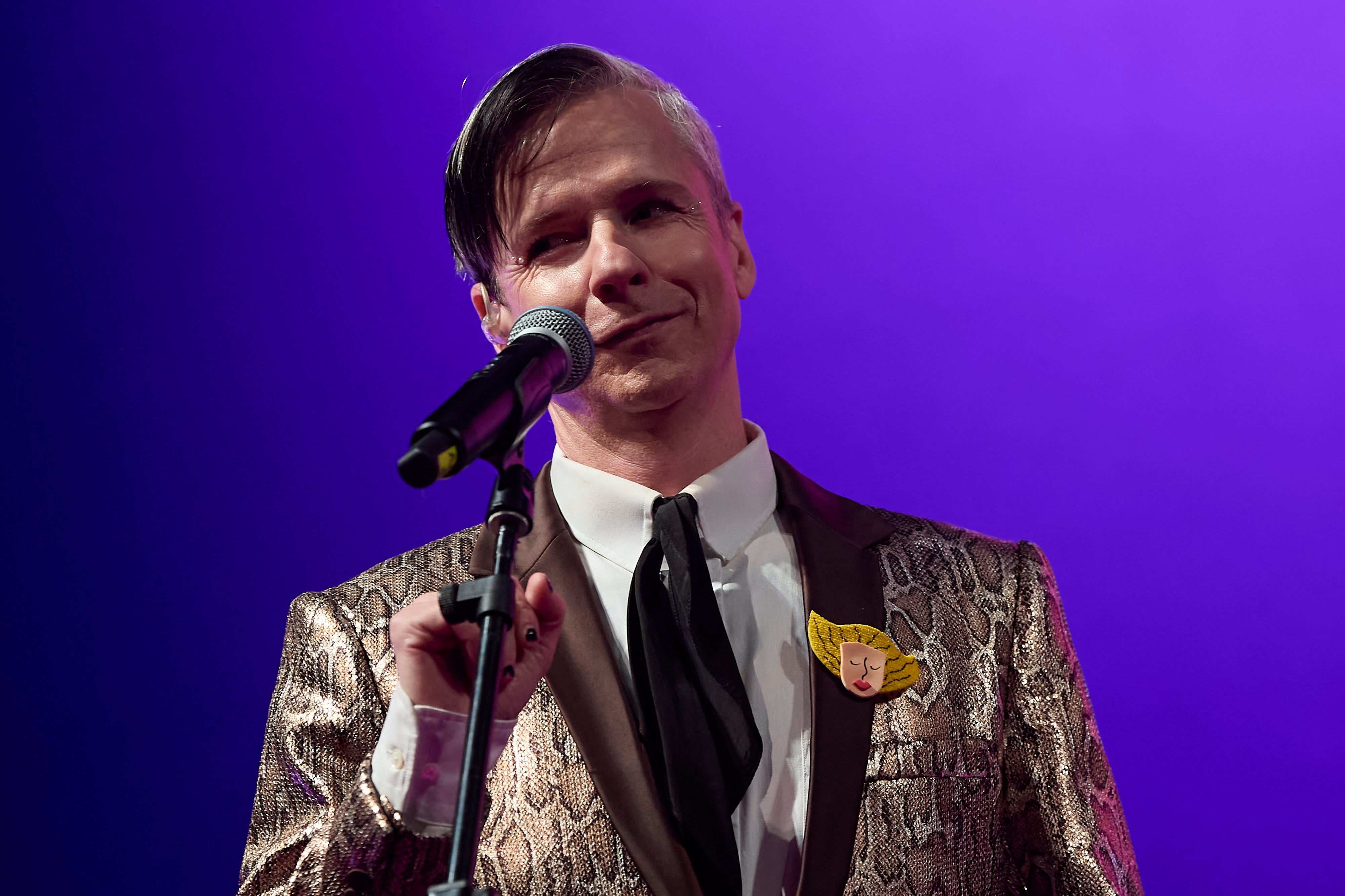 John Cameron Mitchell on stage performing at the Malaga Film Festival in 2022