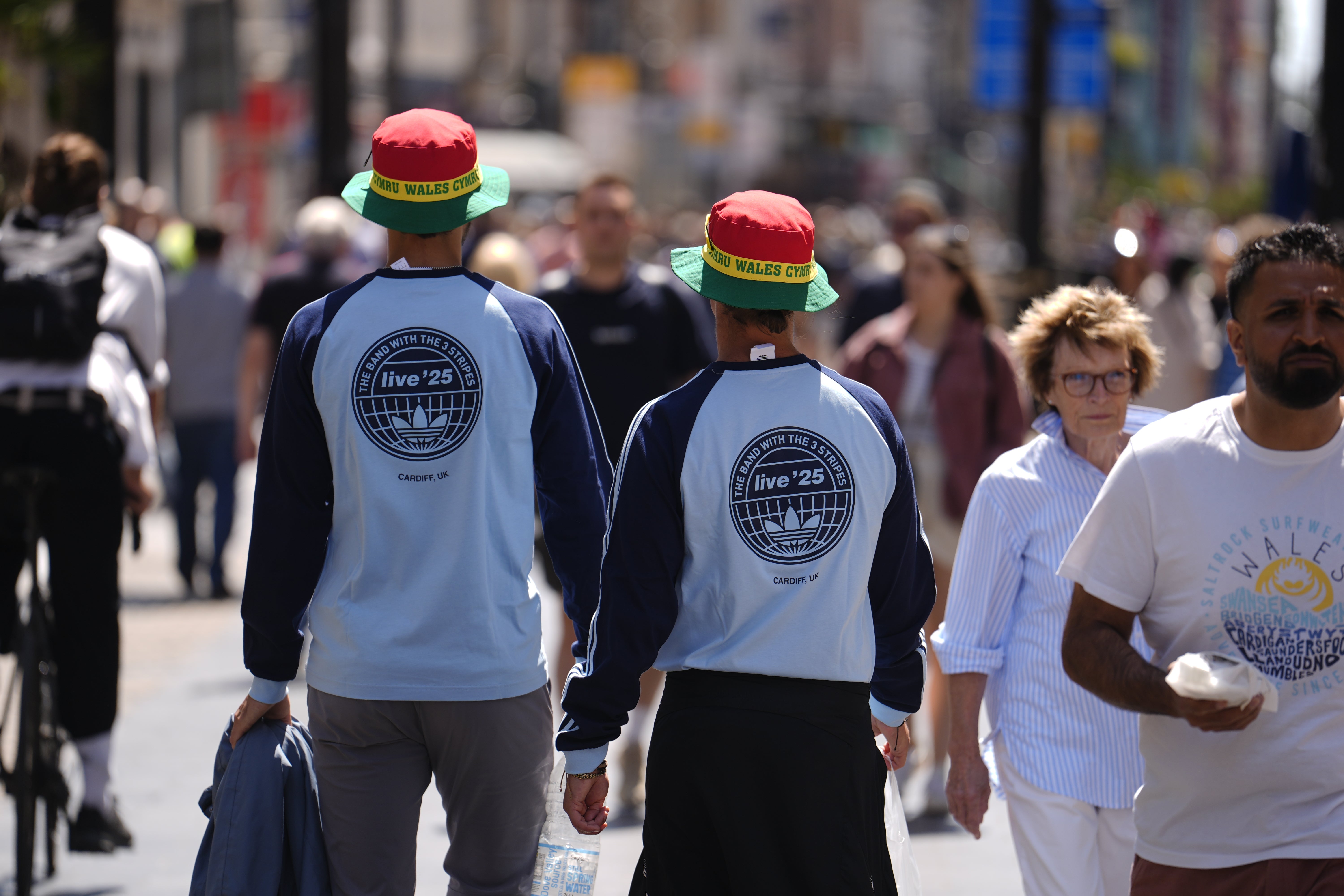 Fans wearing merchandise from the band’s collaboration with Adidas (Jordan Pettitt/PA)
