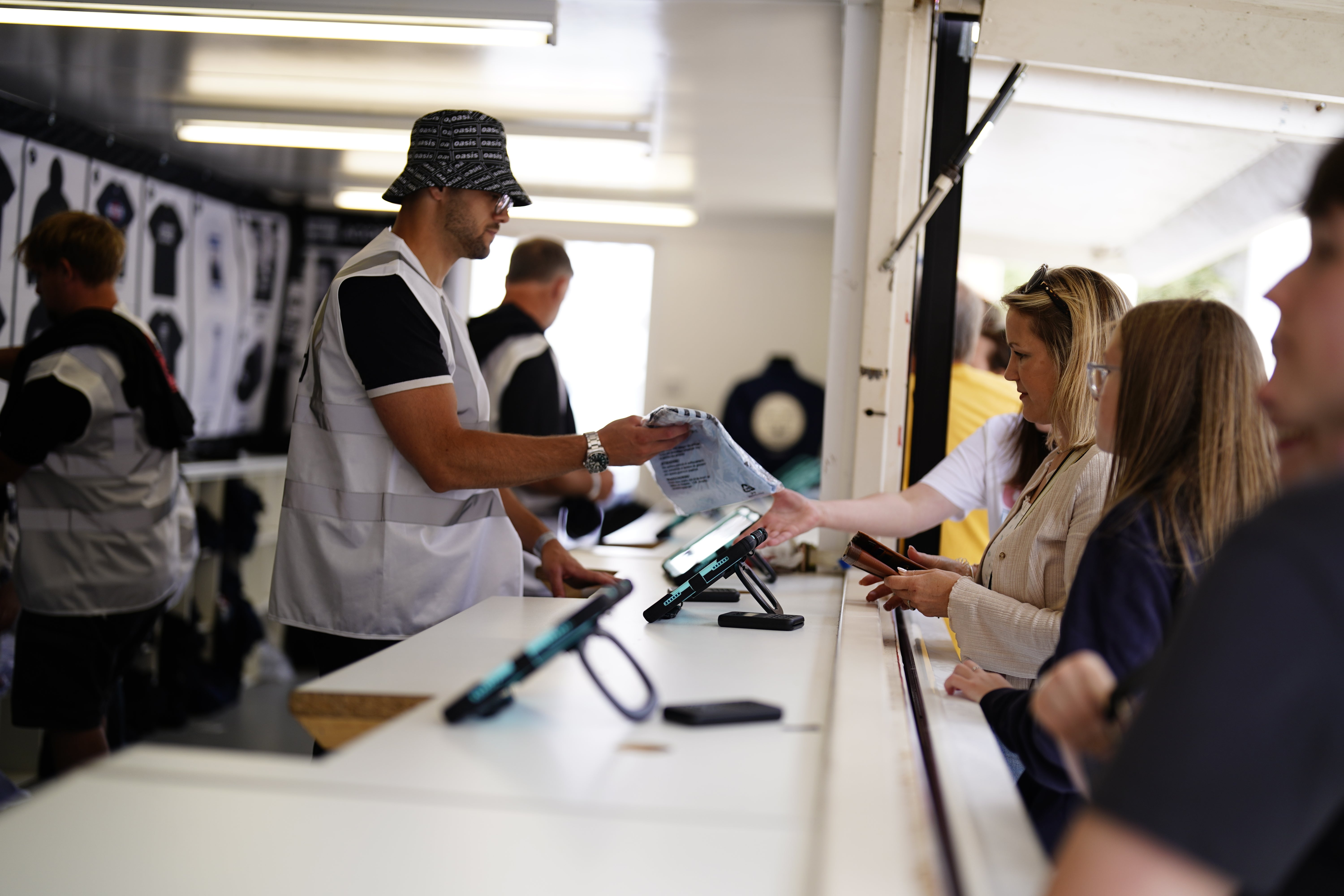 Fans purchase merchandise from the official stand outside the Principality Stadium (Jordan Pettitt/PA)