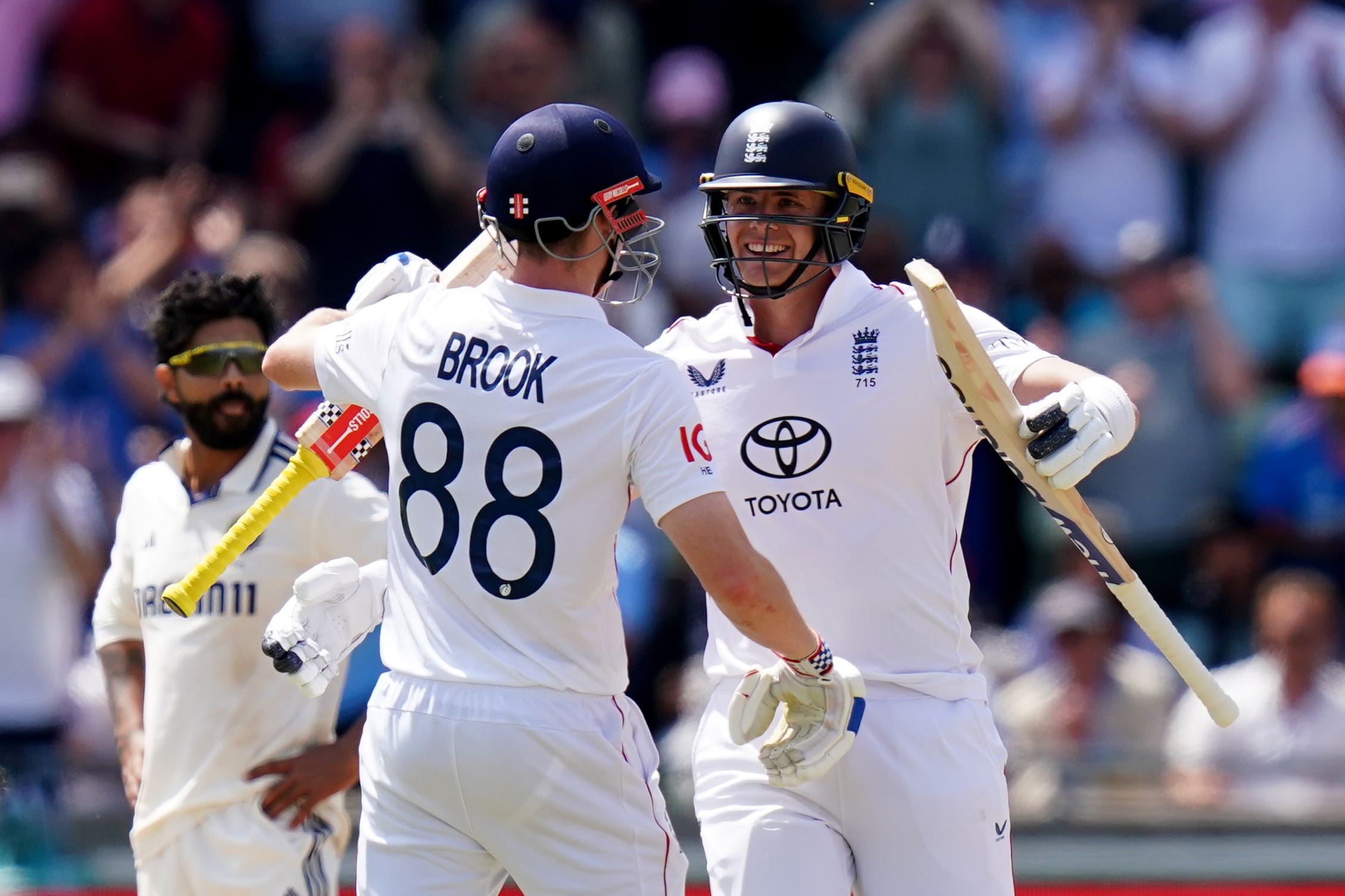 Jamie Smith celebrates his century with team-mate Harry Brook (Jacob King/PA)