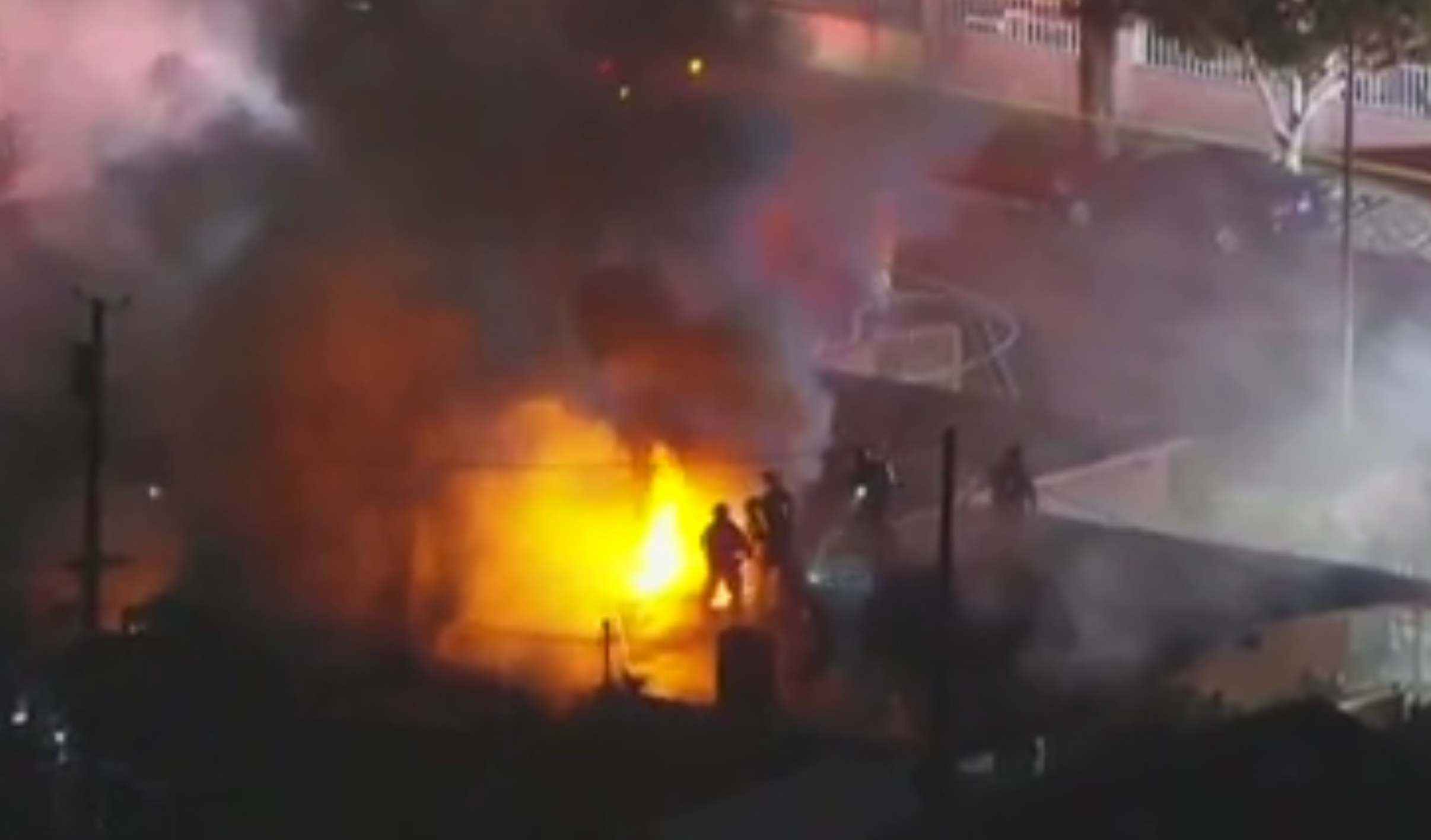 Firefighters tackle a blaze after fireworks detonated in Pacoima, California. One person was killed in the incident.