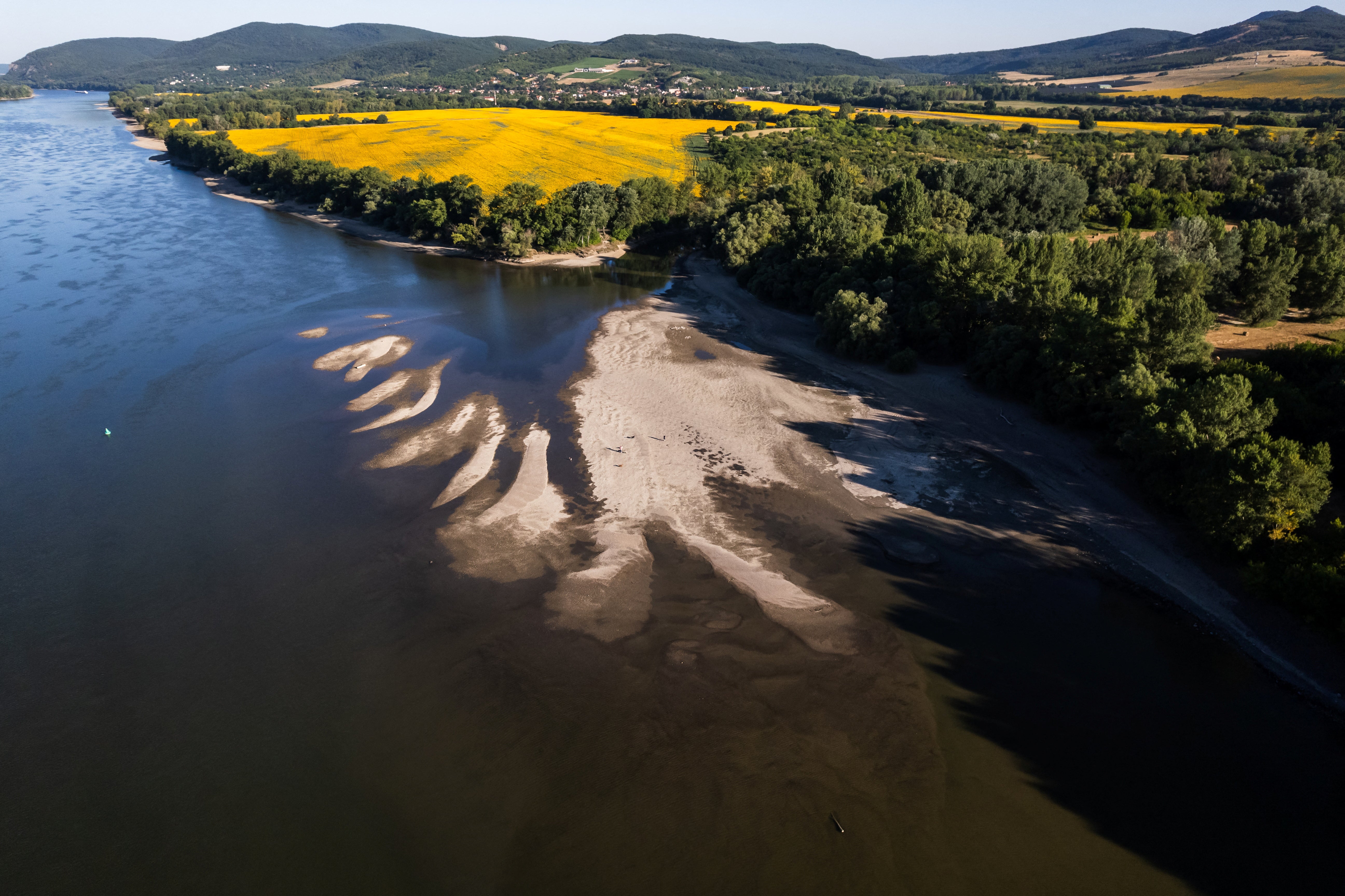 A drone view shows sandbanks emerging from the water due to the low water level of the Danube at its confluence with the Ipoly near Szob, Hungary