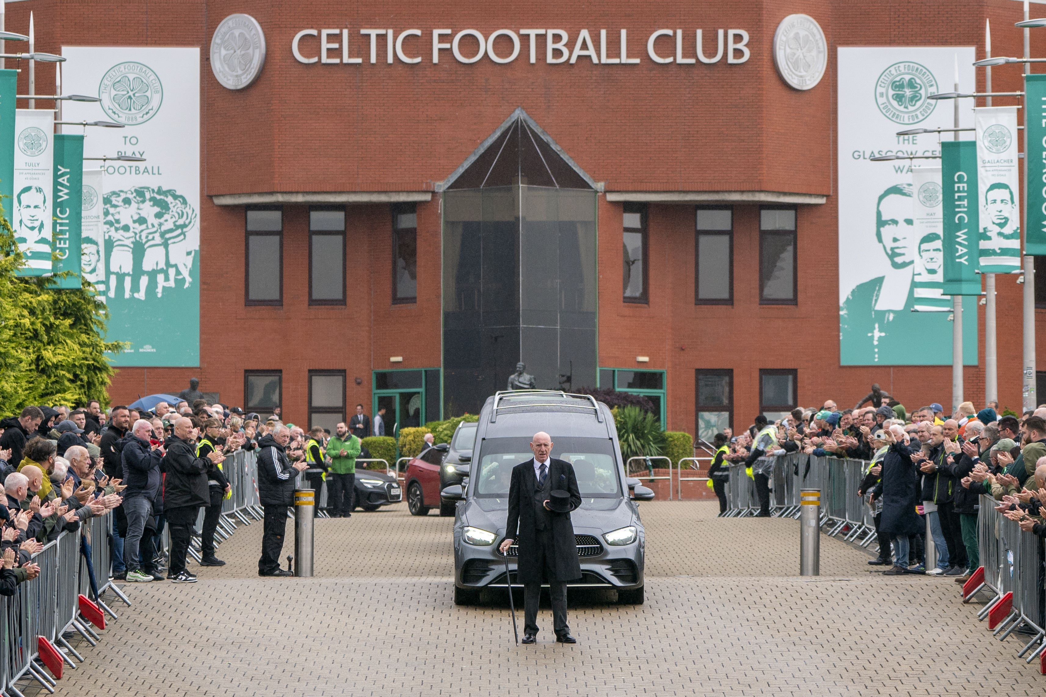The funeral cortege for John Clark passes Celtic Park stadium following a requiem mass held at St Mary’s Church, Glasgow (Jane Barlow/PA)