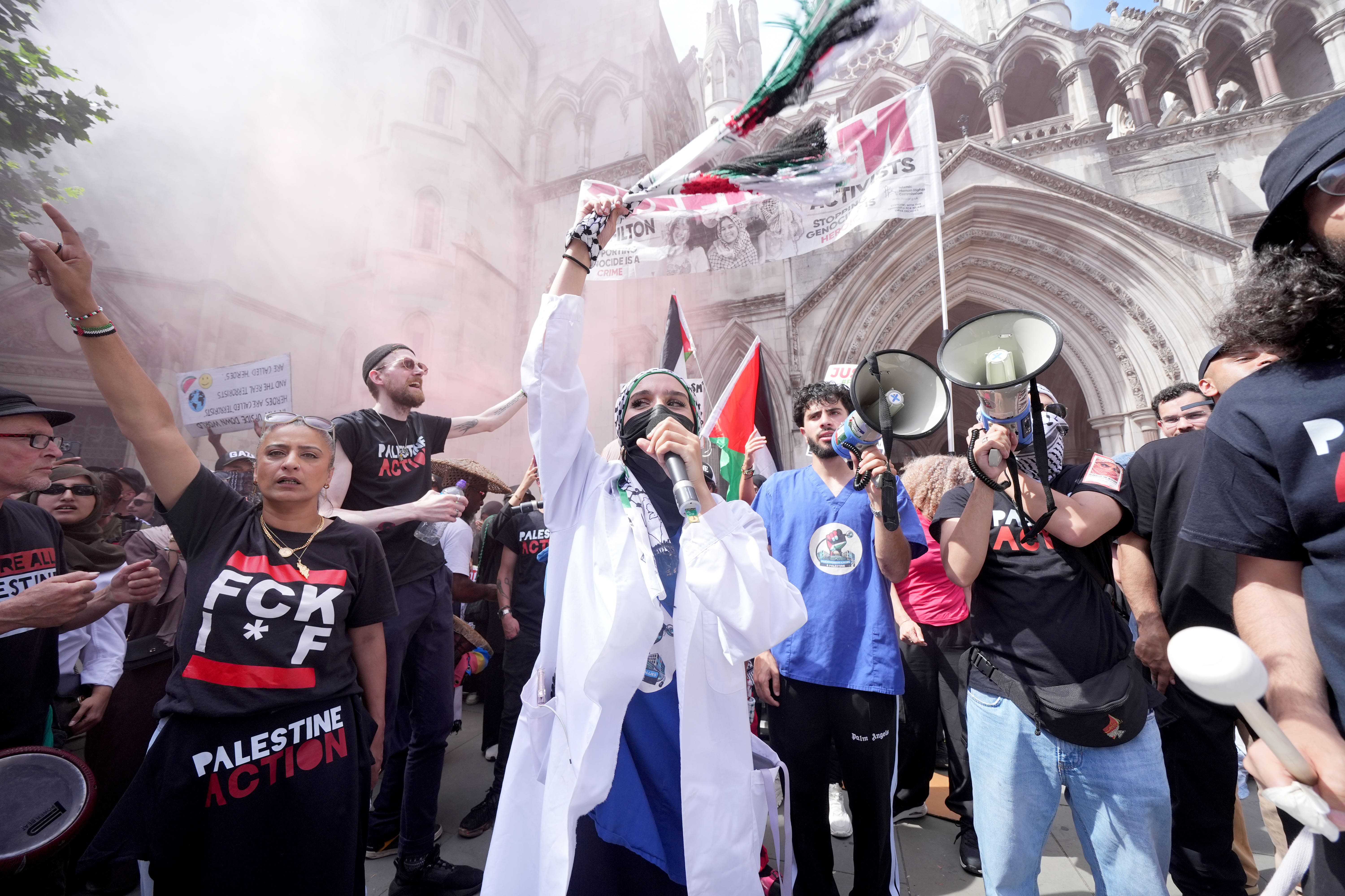 Protesters outside the Royal Courts of Justice (Lucy North/PA)
