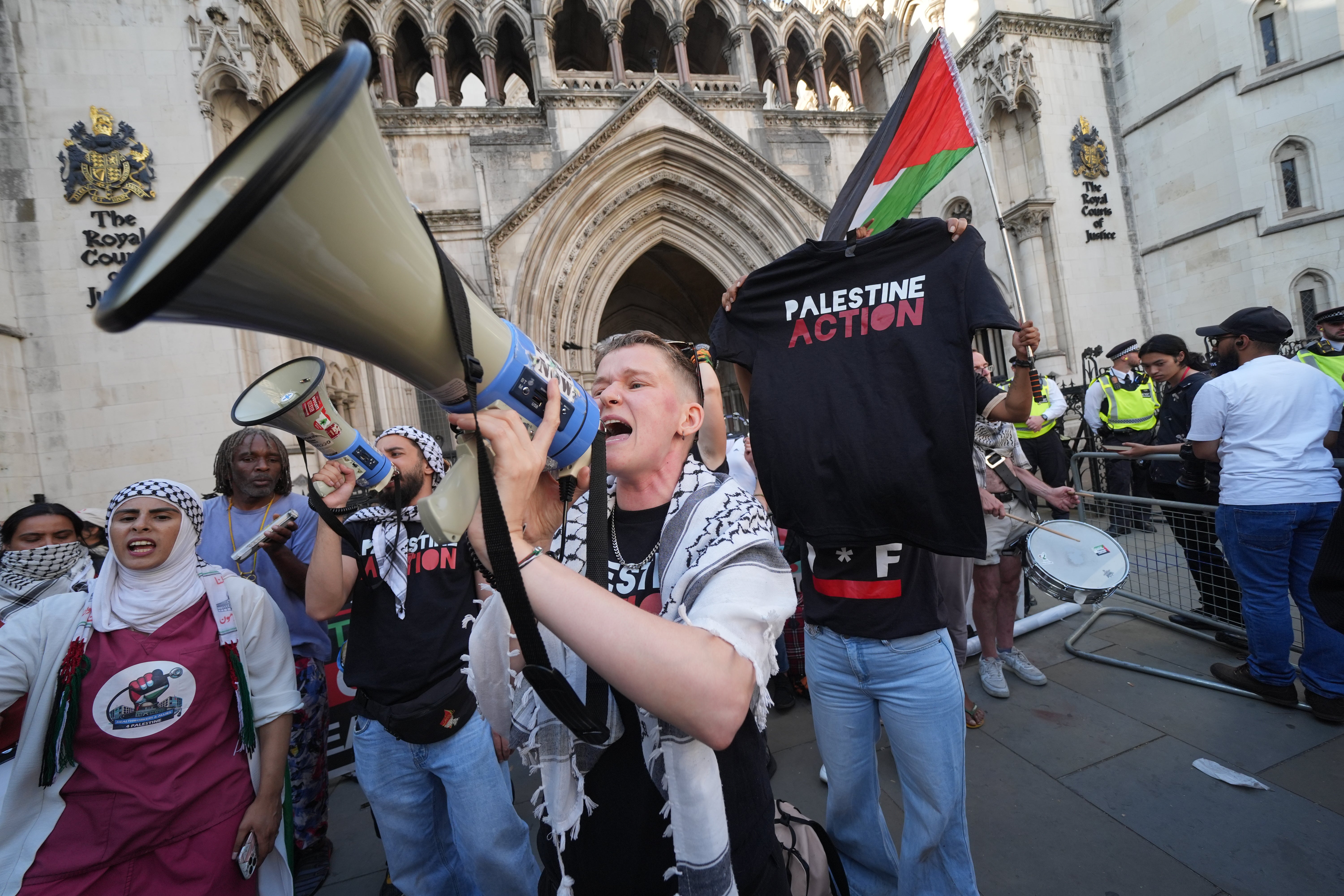 Protesters stood outside the Royal Courts of Justice