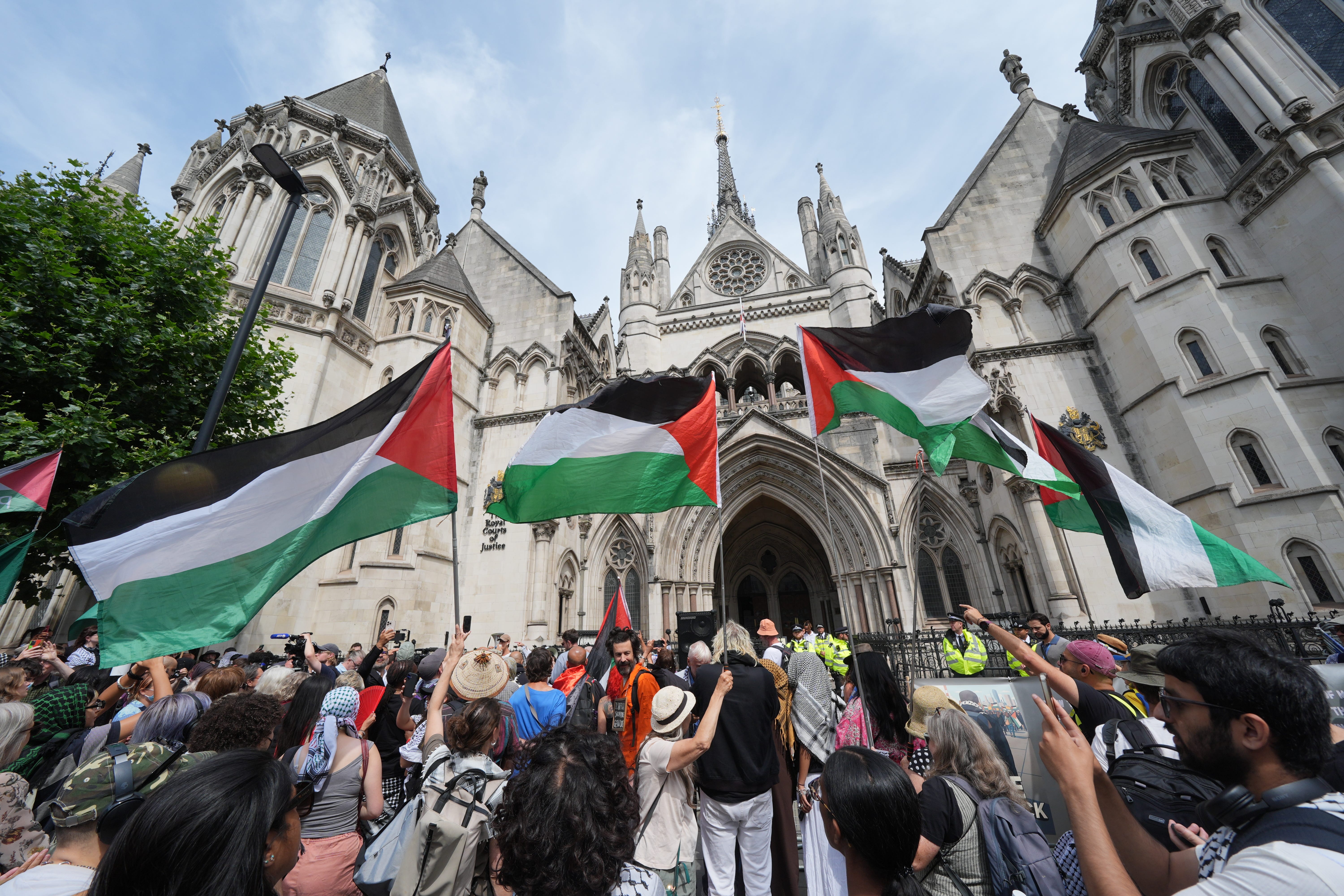 Protesters outside the Royal Courts of Justice on The Strand, central London (Lucy North/PA)