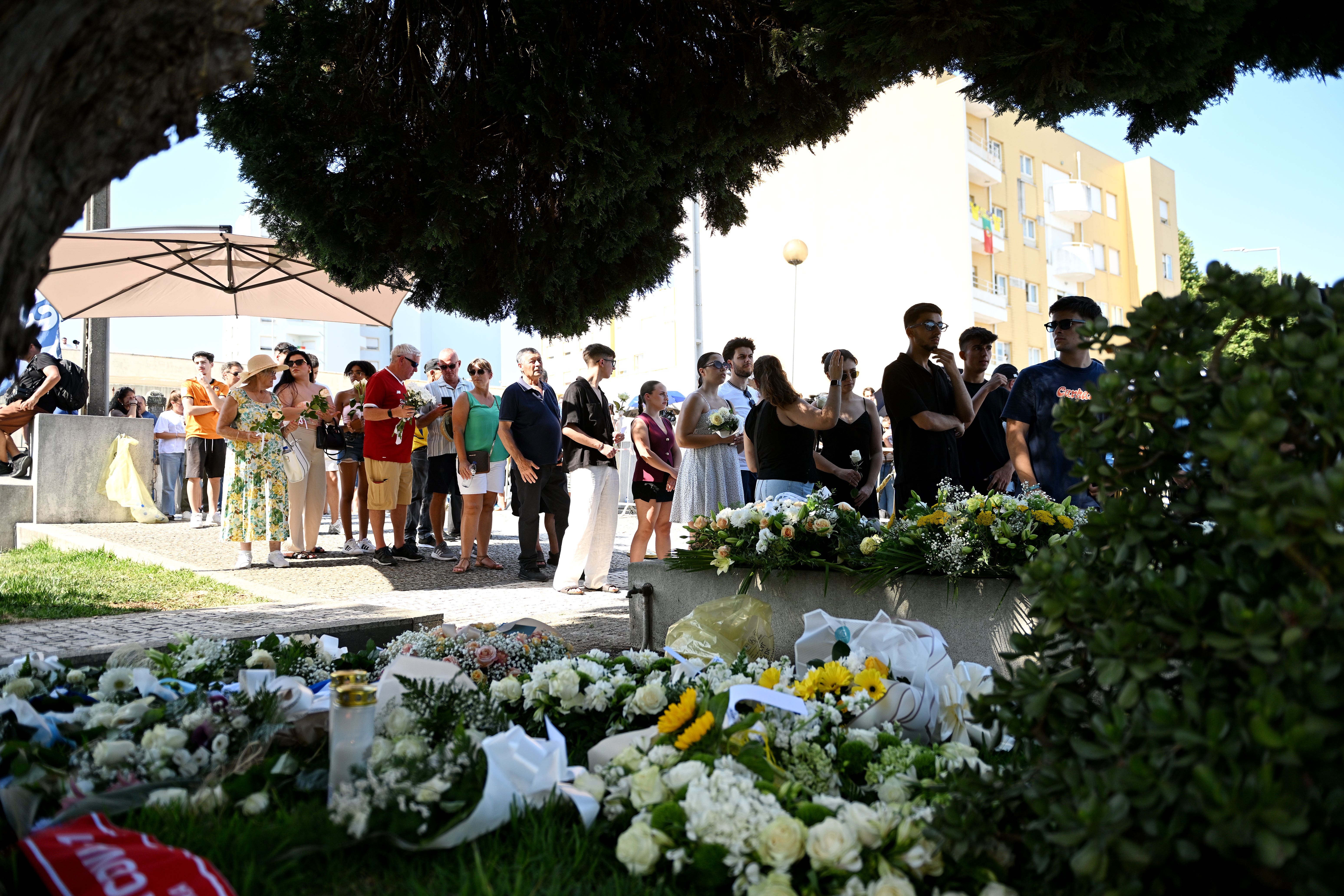 Mourners and floral tributes at the wake of Diogo Jota (PA)