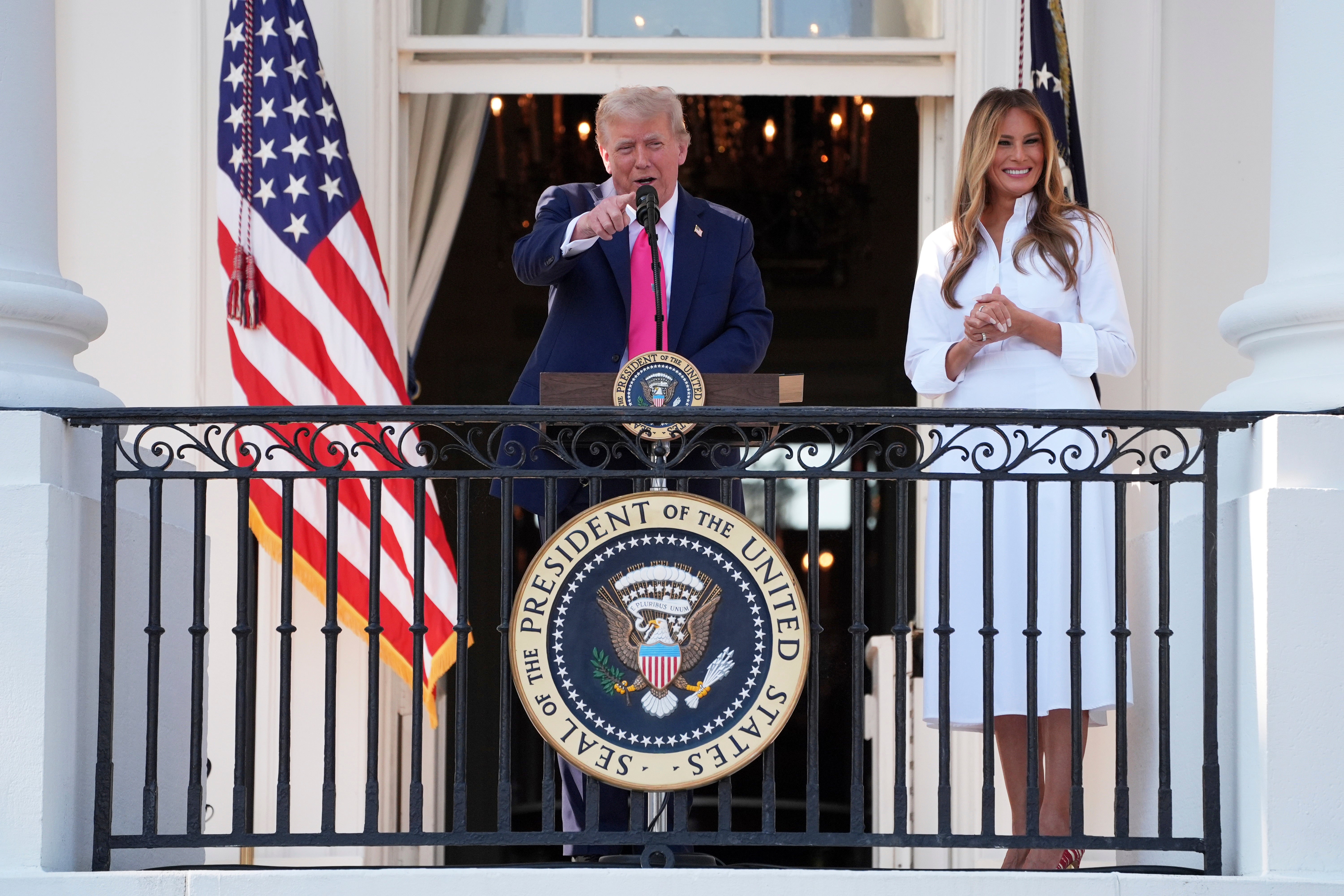 President Donald Trump speaks at the White House with First Lady Melania Trump as he prepares to sign his 'Big, Beautiful Bill'