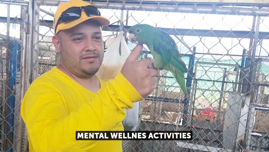 Kilmar Abrego Garcia is seen holding a parrot while in Salvadoran custody