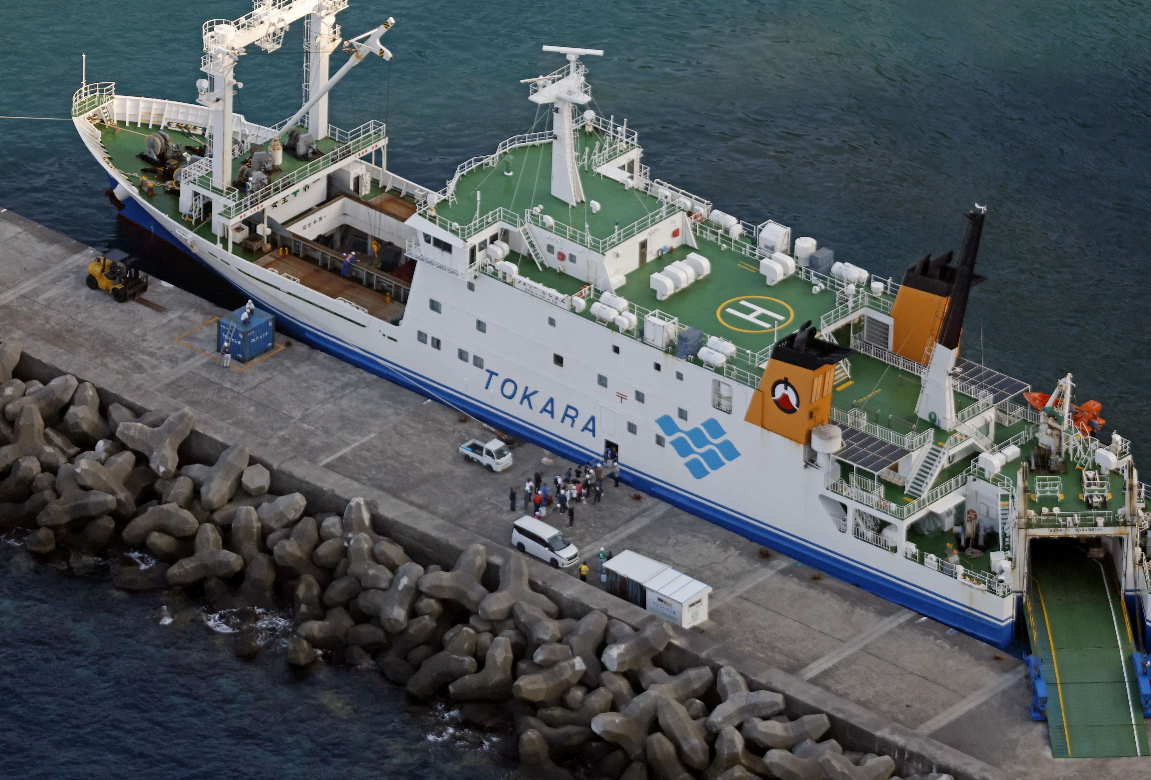 Residents and visitors boarding a ferry to evacuate from Akuseki Island, as multiple earthquakes hit the island, a part of the Tokara island chain, in Toshima Village, Kagoshima prefecture