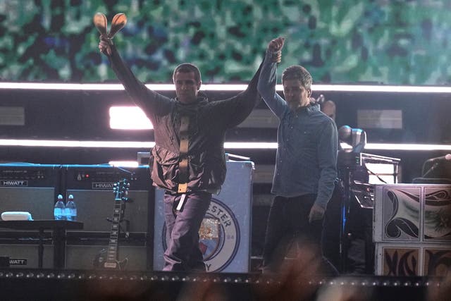 <p>Liam and Noel Gallagher at the beginning of their barnstorming set</p>