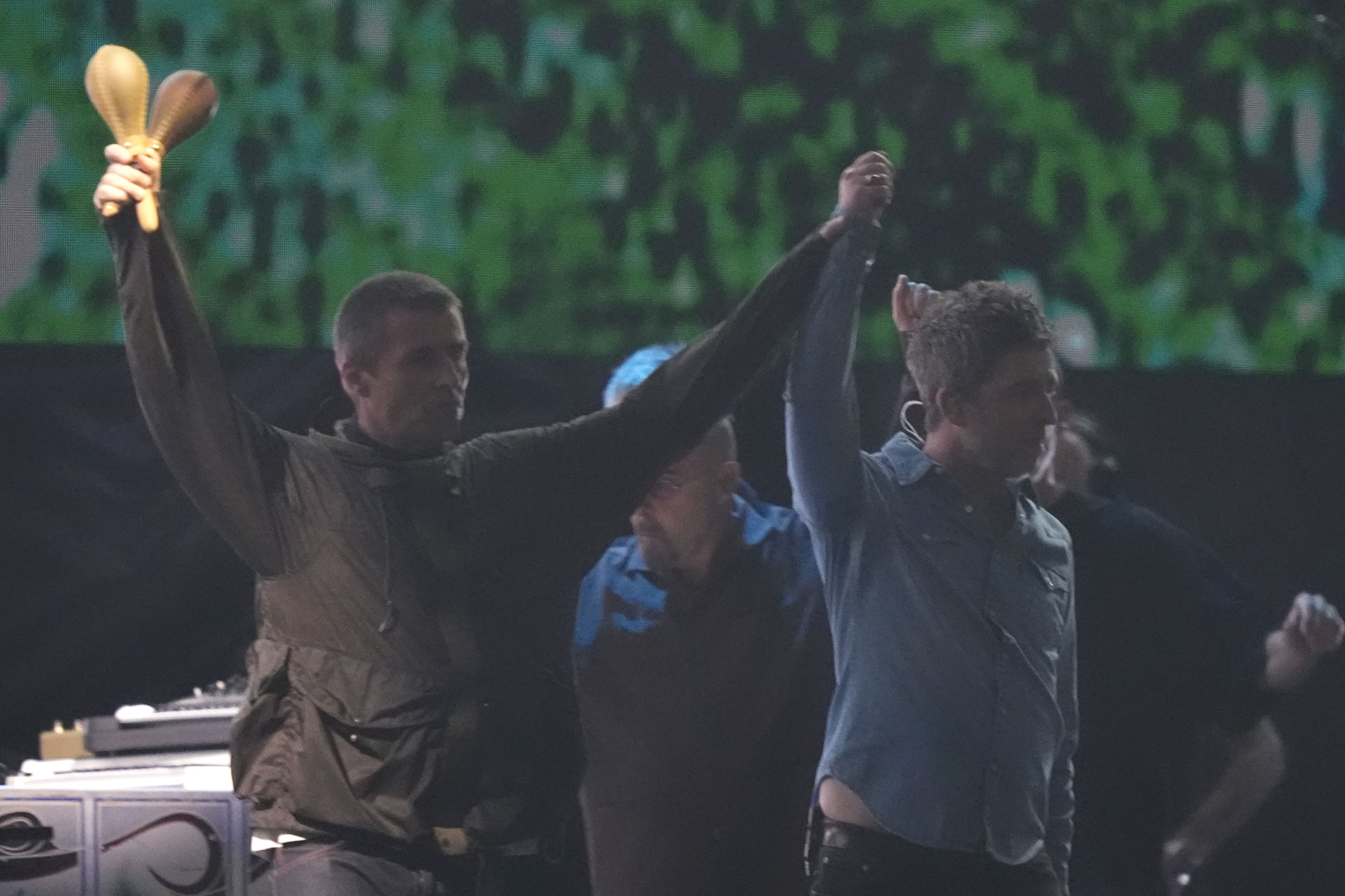 Liam and Noel Gallagher arrive on stage (Jordan Pettitt/PA)