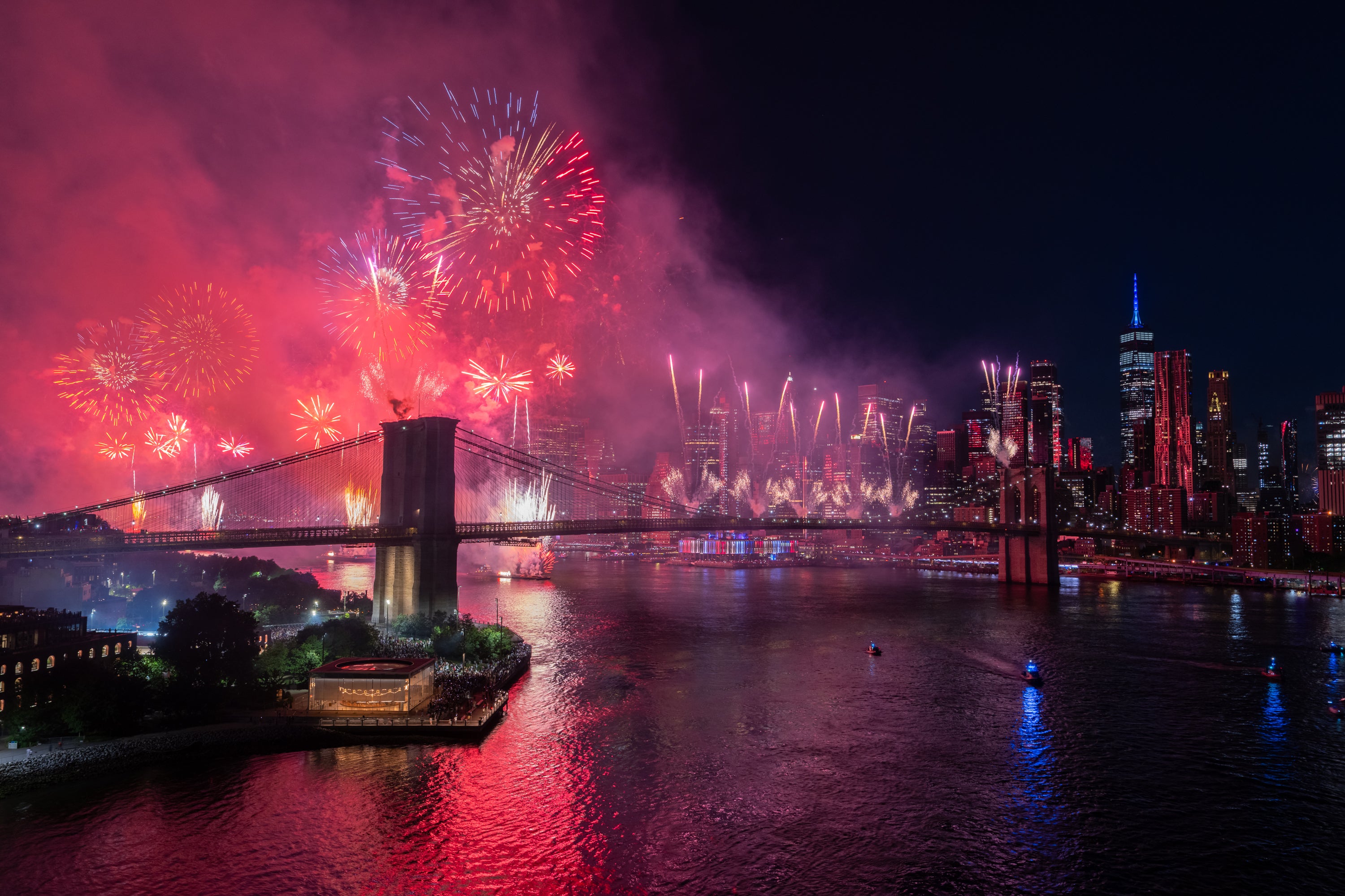 Fireworks explode over the Brooklyn Bridge. New York City handed out 100,000 free tickets so residents could watch the Independence Day celebration from designated viewing areas