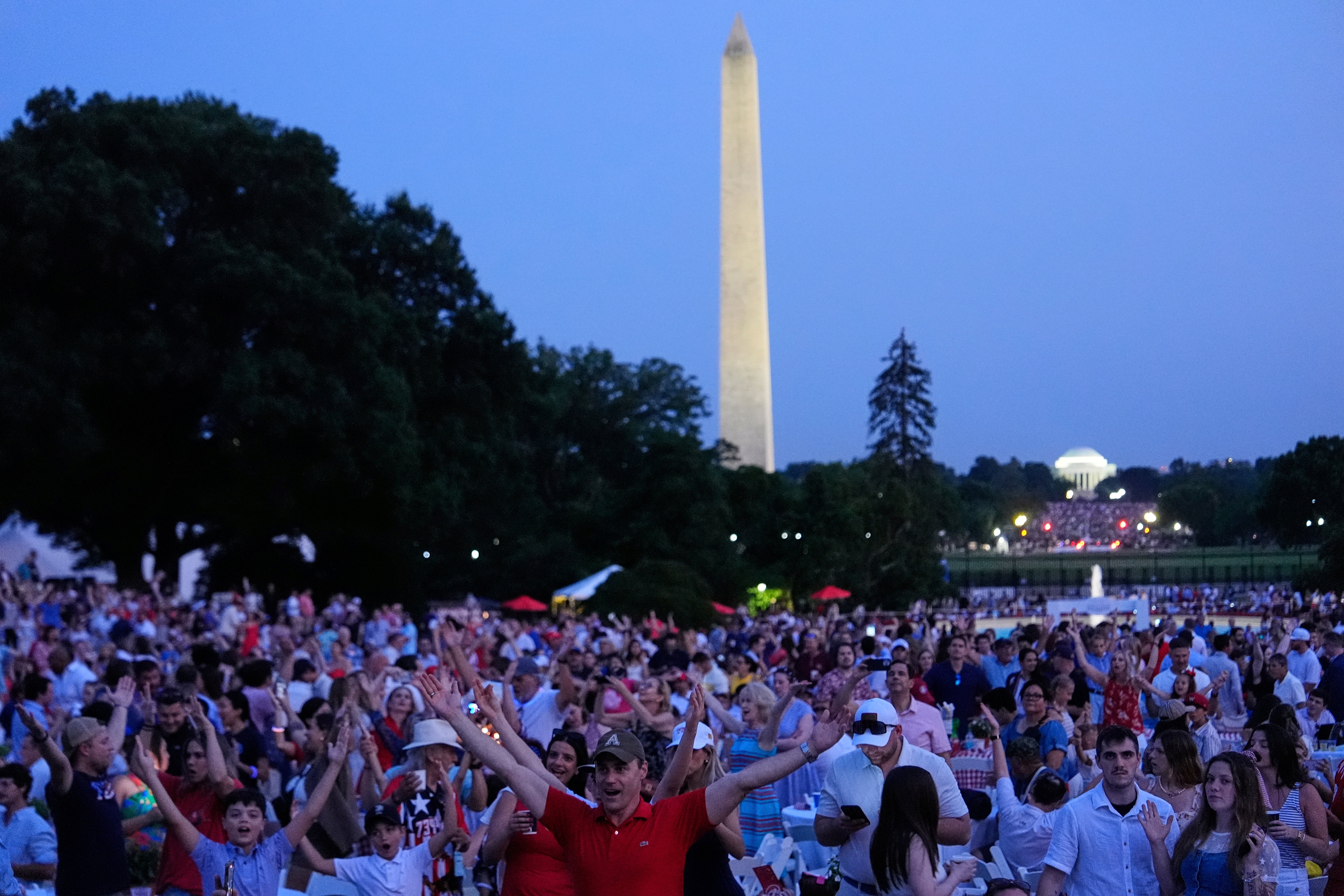 People dance to the song 'Y.M.C.A' on the South Lawn of the White House ahead of the Washington, D.C. Independence Day fireworks show