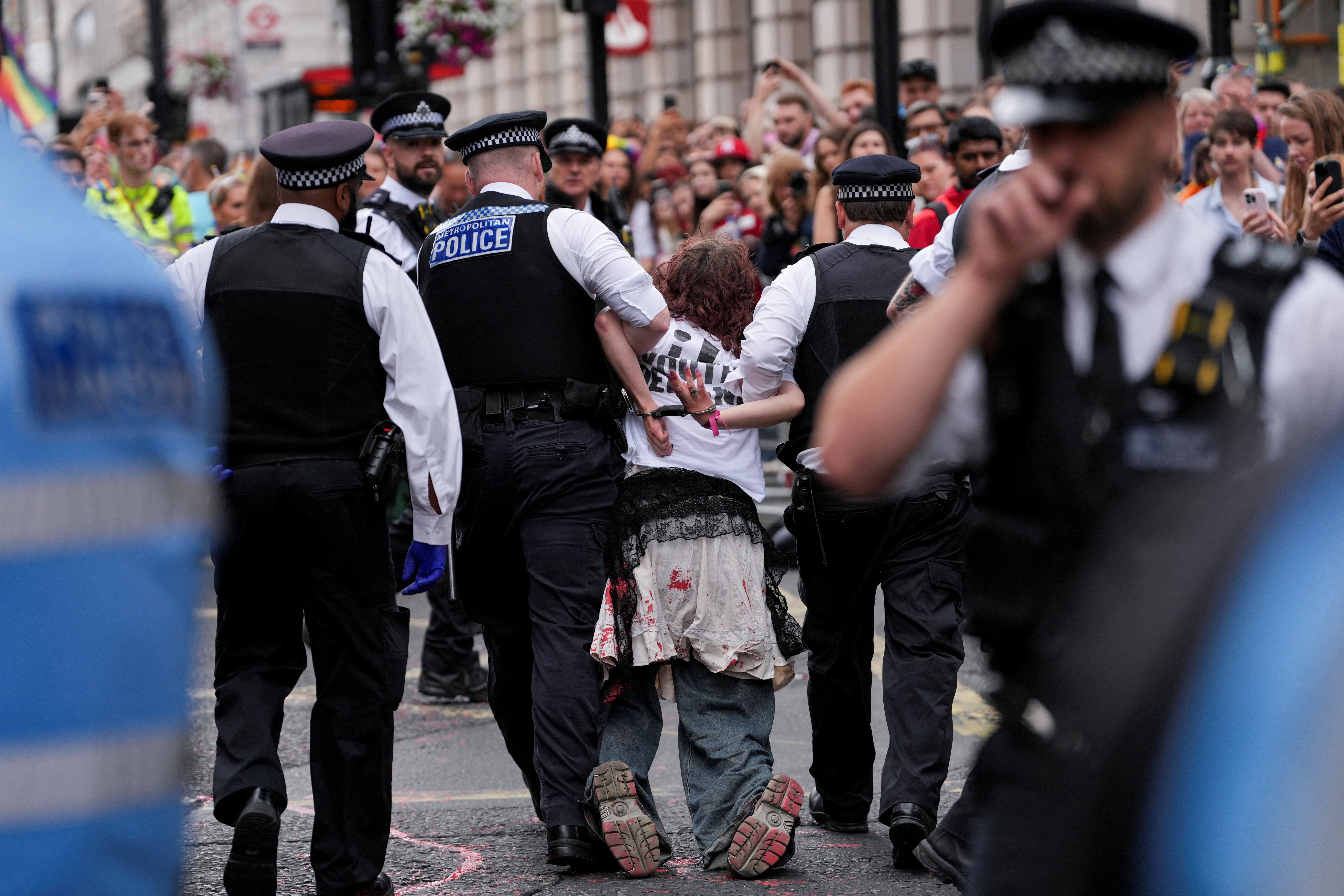 The protesters were pictures being arrested and taken away by police.