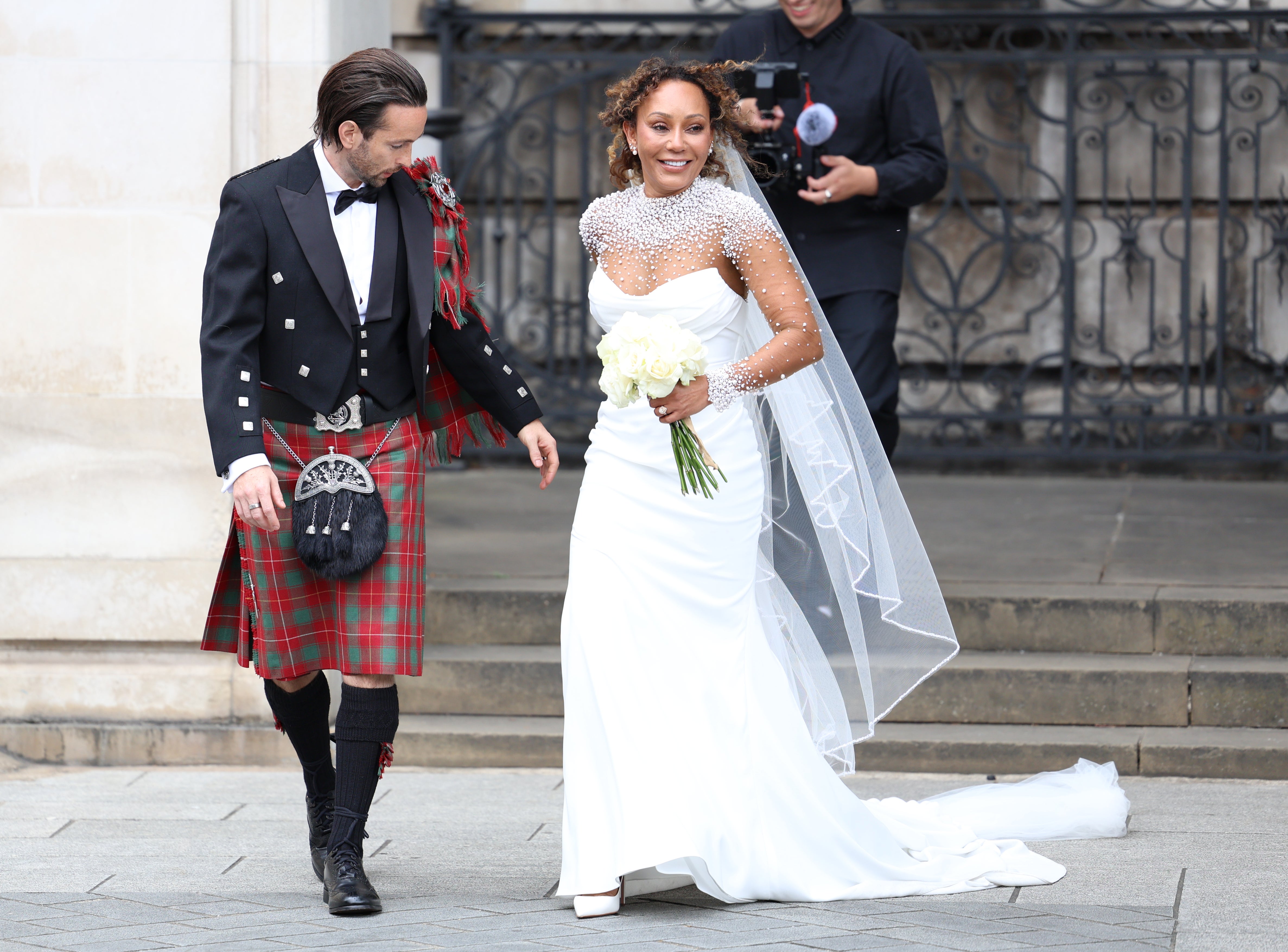 Spice Girl Melanie Brown and her husband Rory McPhee leave St Paul’s Cathedral, London, after their wedding (Toby Shepheard/PA)
