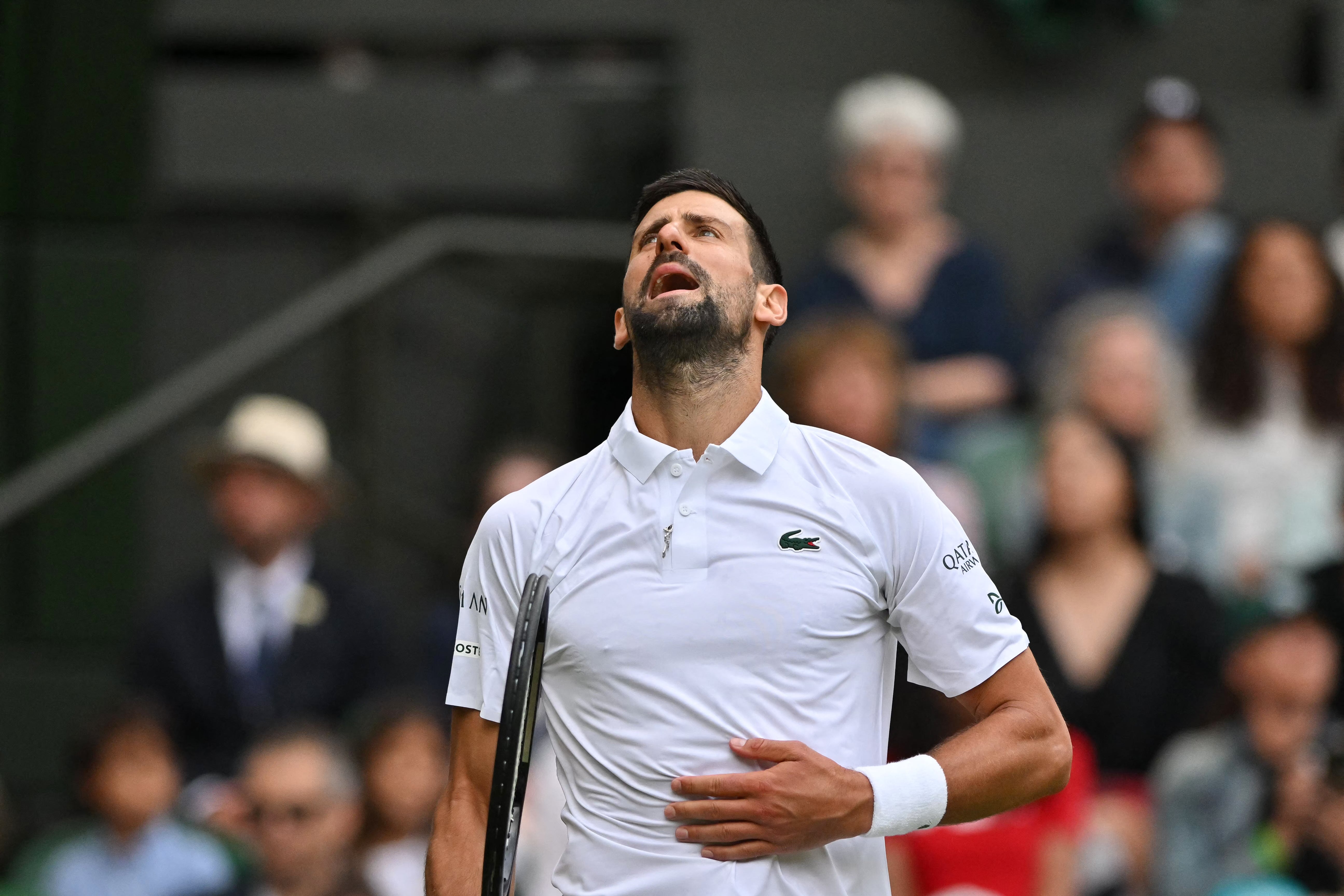 Novak Djokovic takes a second to recover after a long rally