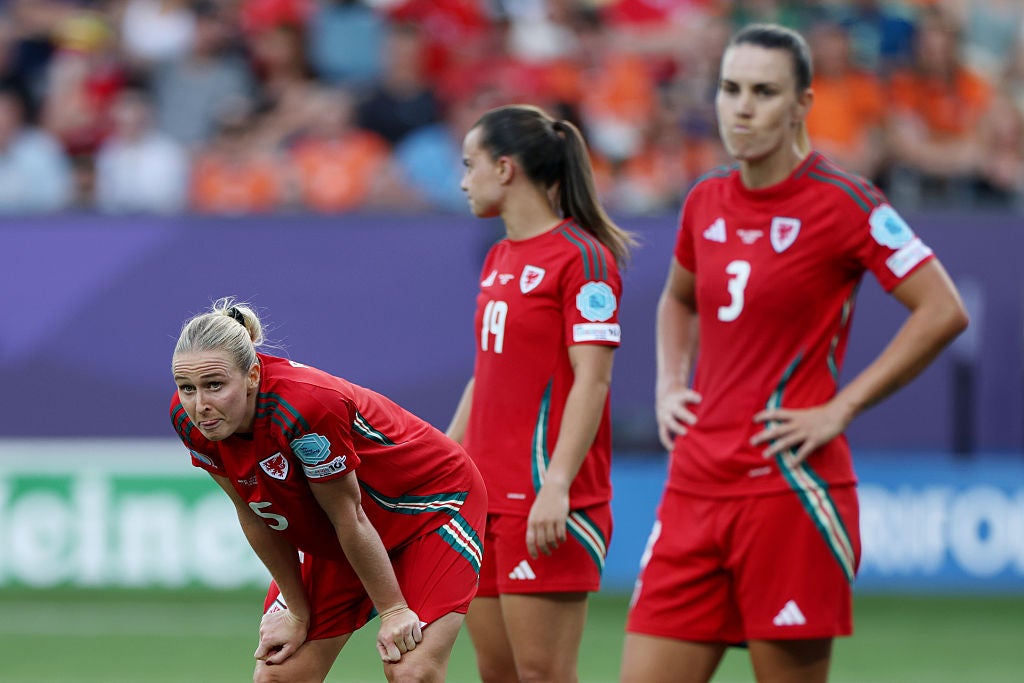 Rhiannon Roberts, Ella Powell and Gemma Evans of Wales look dejected after the teams defeat