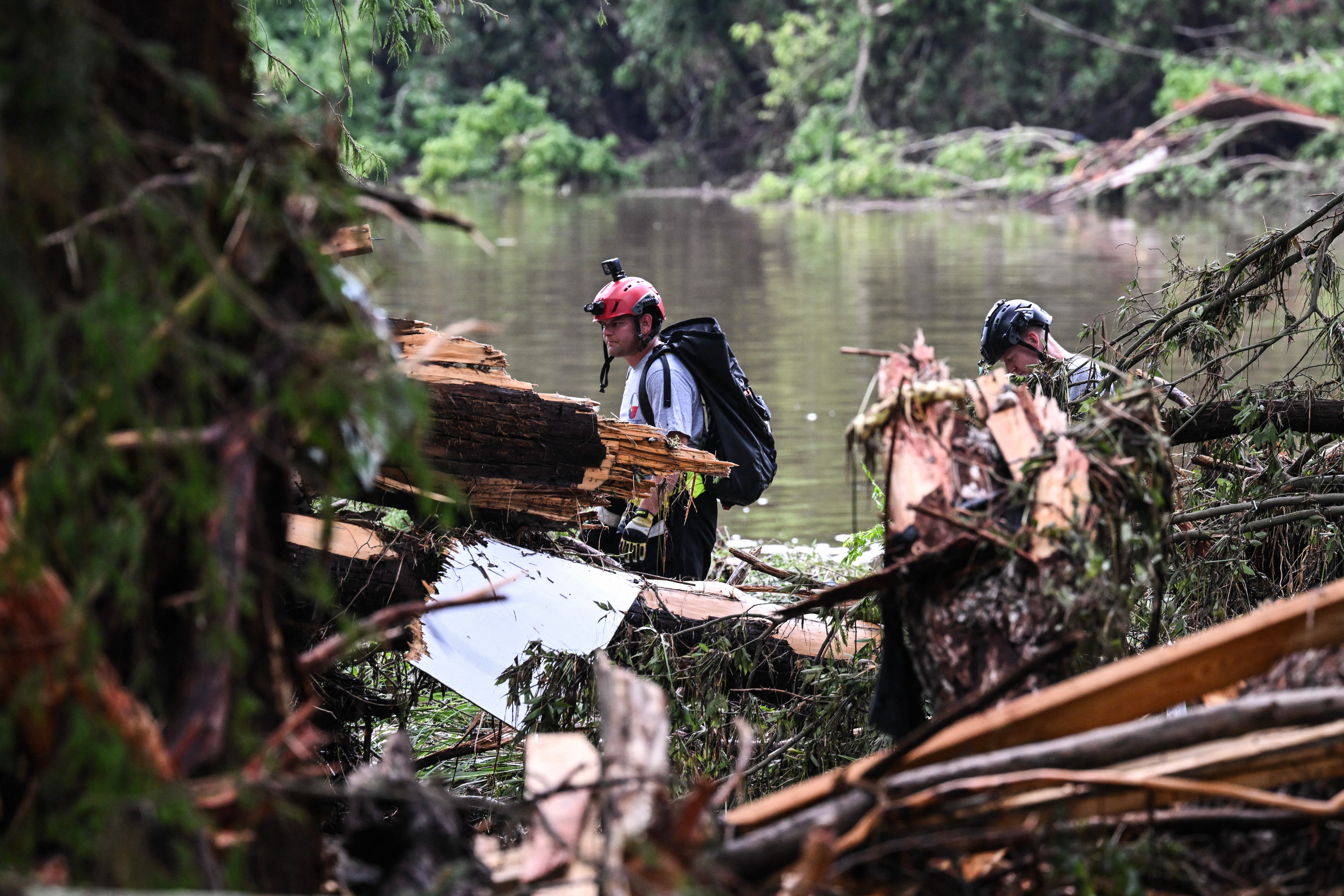 Members of a search the ruins of Camp Mystic on July 5. 27 attendees remain unaccounted for.