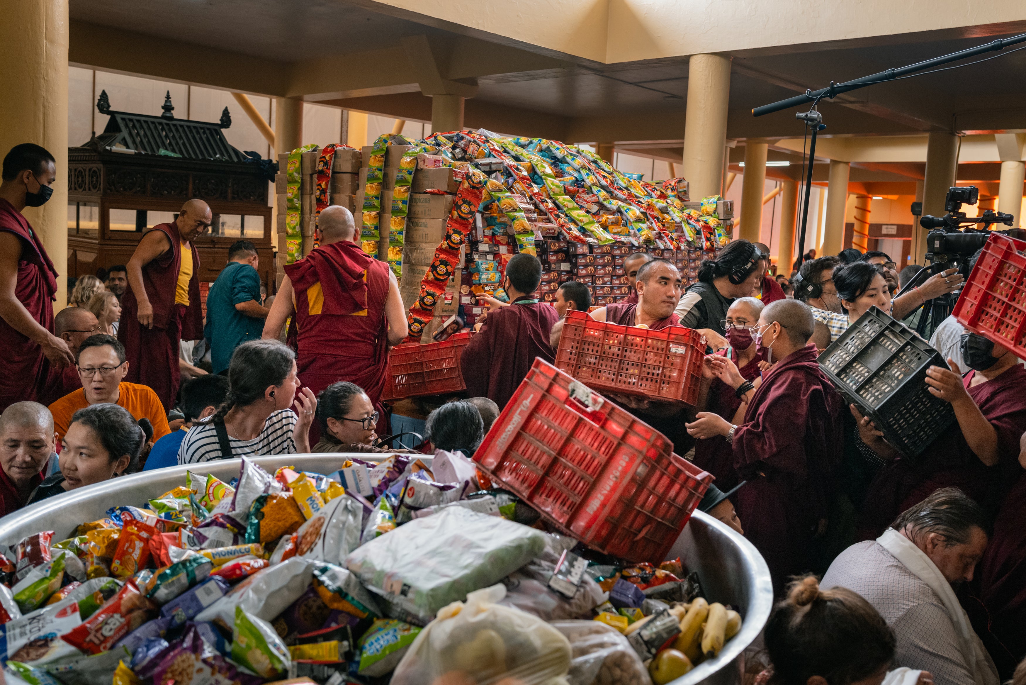 Monks donate food for the long-life prayer to celebrate the upcoming birthday of the 14th Dalai Lama at Tsuglagkhang