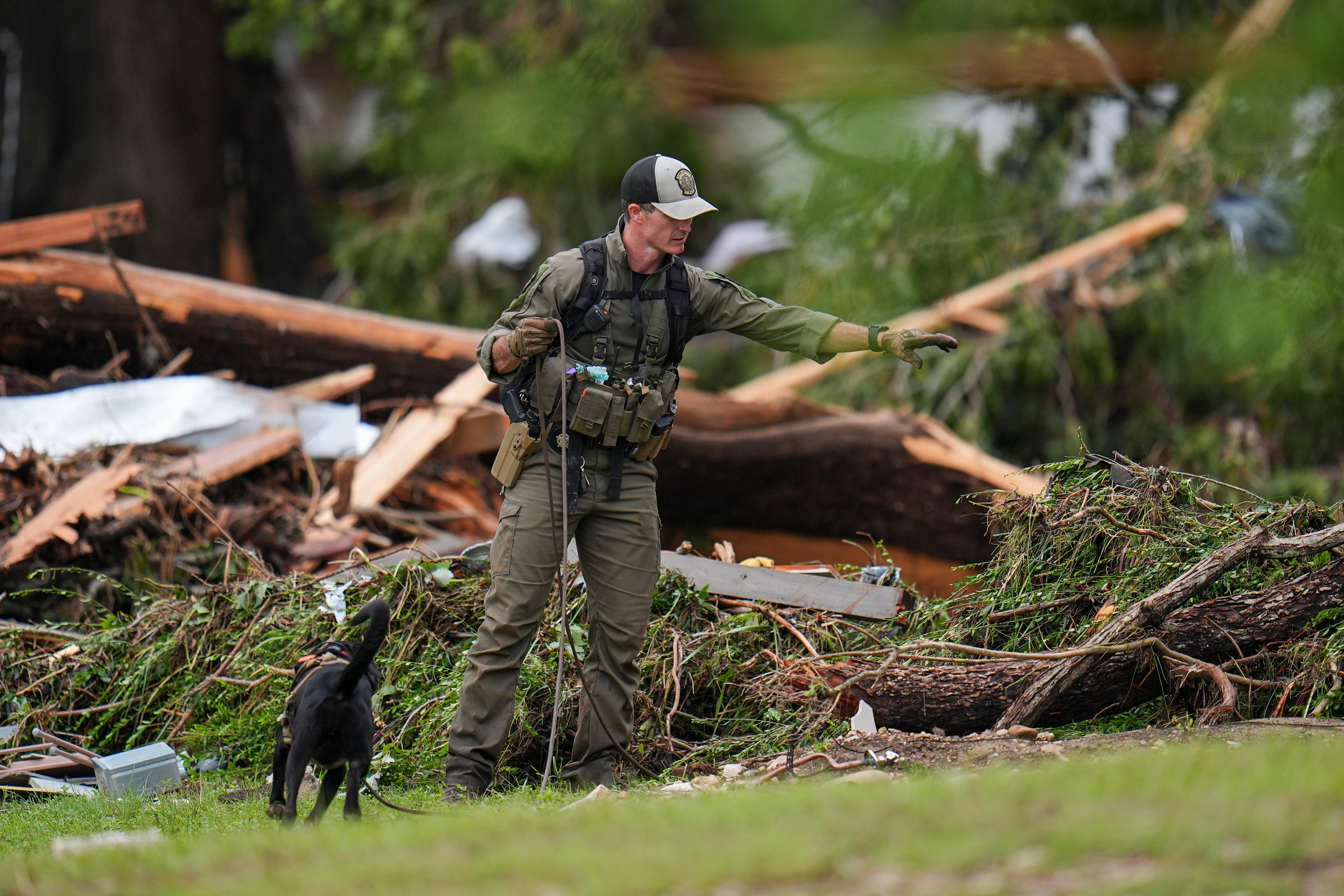 Officials comb areas hit by flooding in search of victims after floods in Texas.