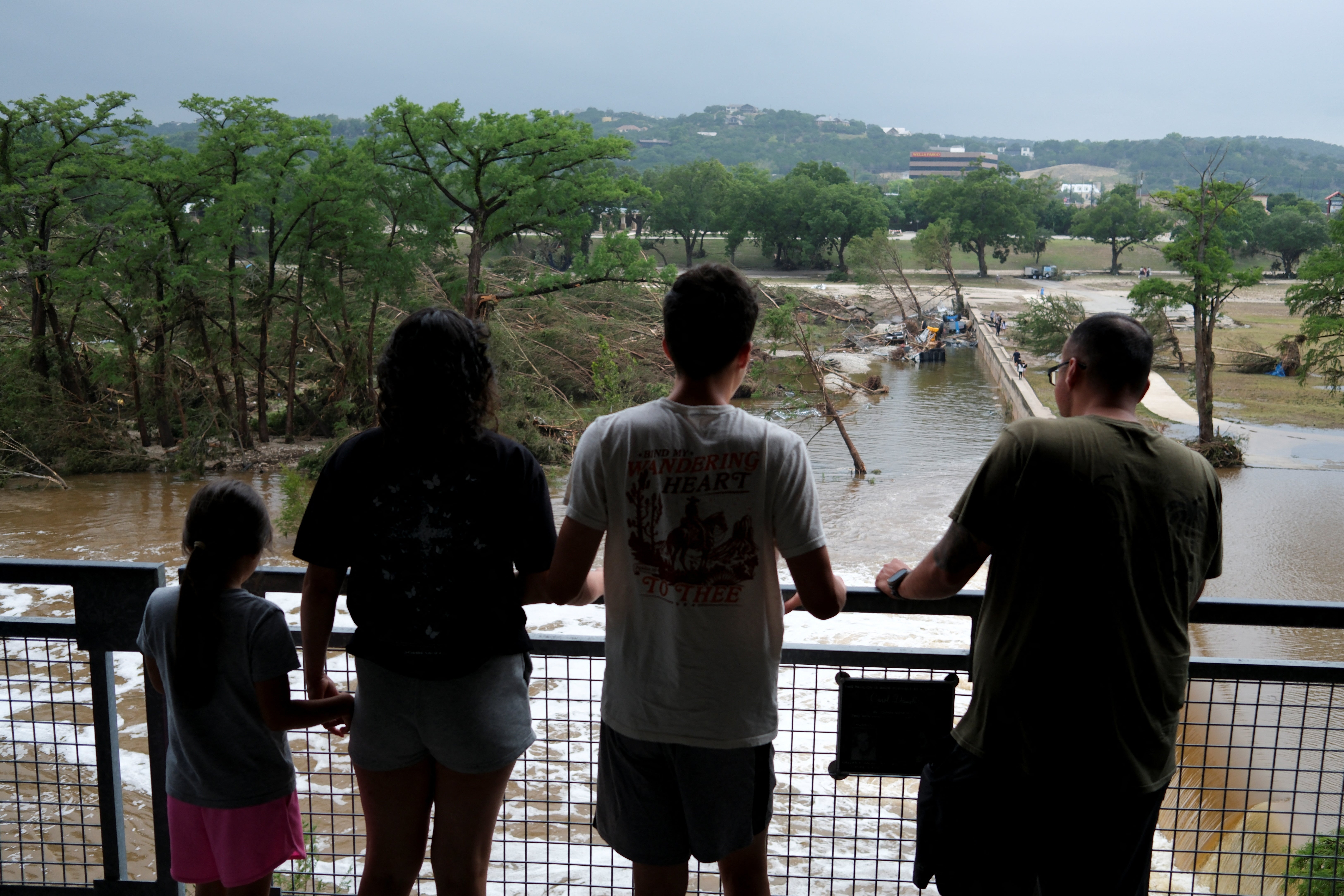 Residents look at the debris after devastating floods in Texas.