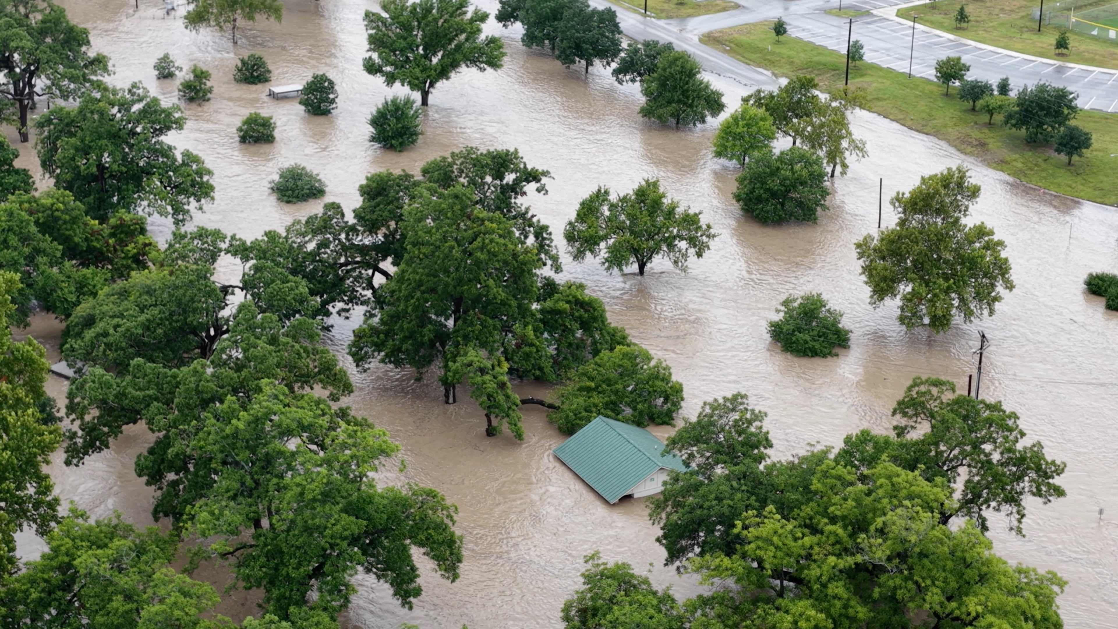 A drone view shows an area flooded by the swollen San Gabriel river, in Georgetown, Texas