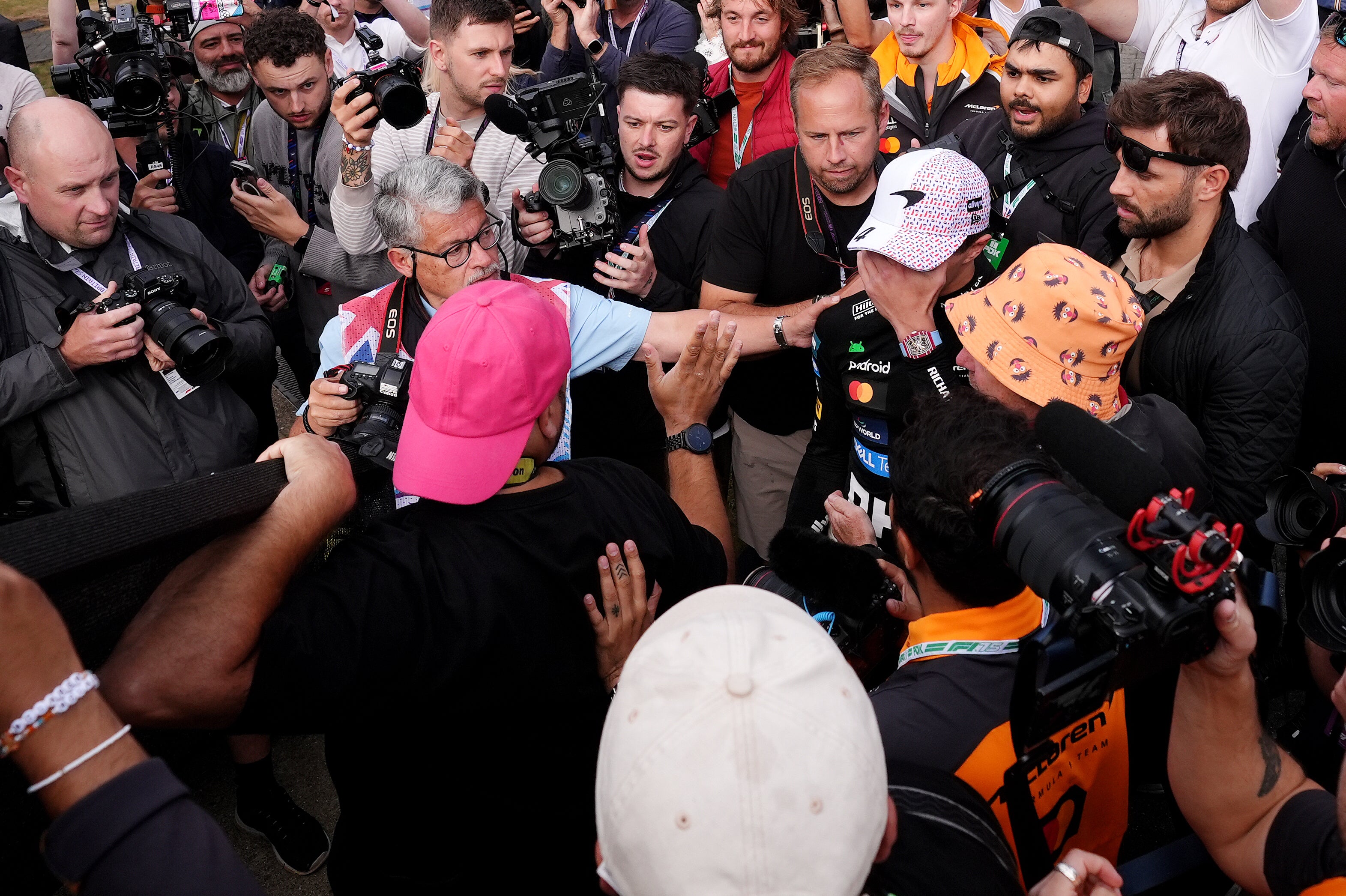 A photographer tumbled into Lando Norris