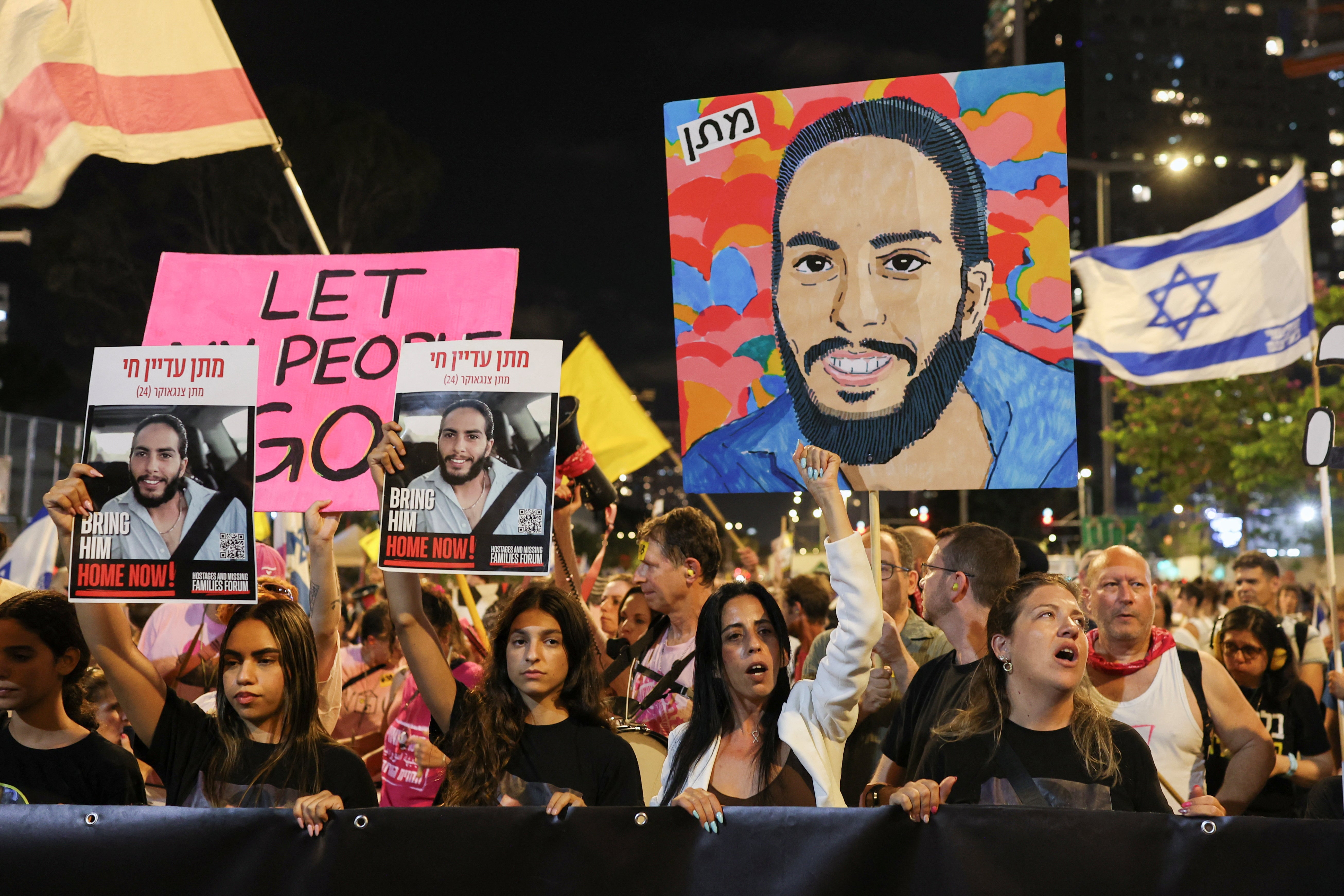 Demonstrators take part in a protest to demand the immediate release of hostages held in Gaza