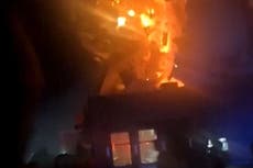 Explosion tears roof off Domino’s Pizza after car crashes into restaurant