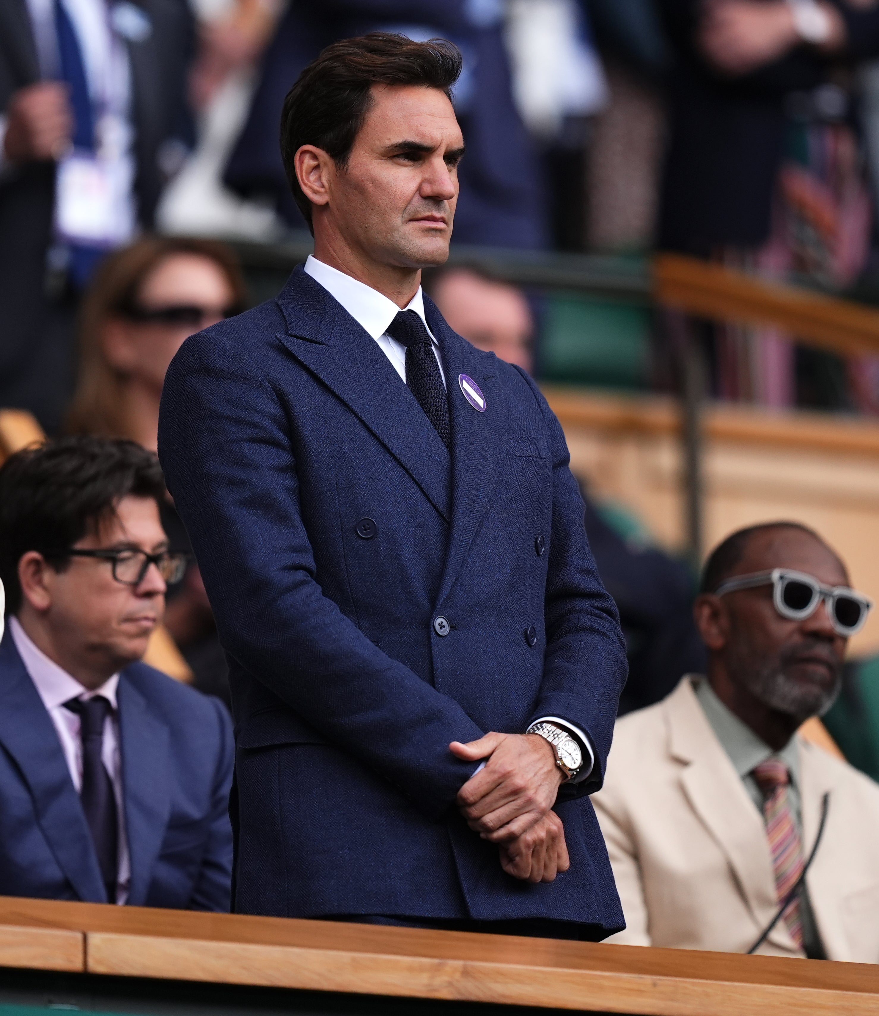 Roger Federer looks on from the Royal Box on Centre Court