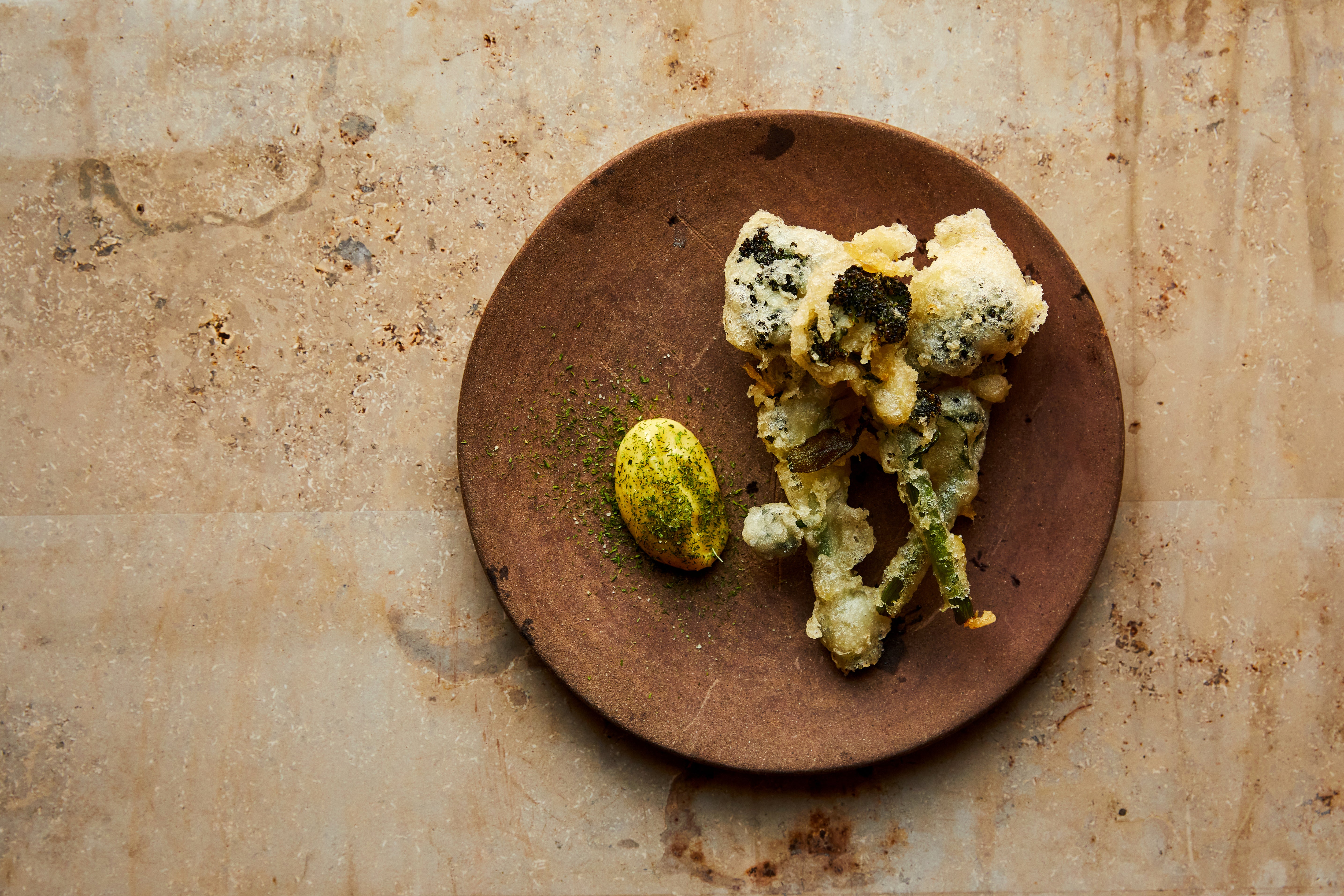 This purple sprouting broccoli tempura makes the most of a fleeting British crop, paired with an elderflower mayonnaise that captures the scent of early summer