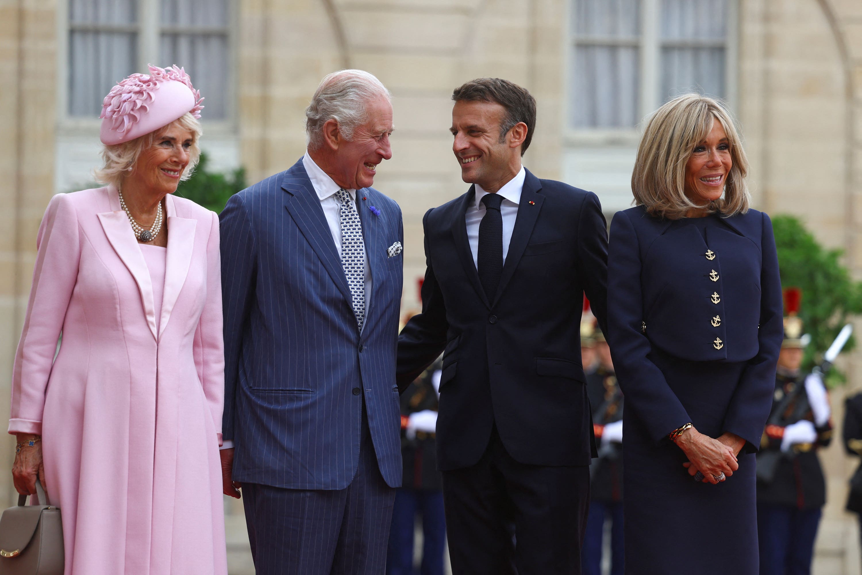 The King and Queen with Emmanuel and Brigitte Macron in France in 2023 (Hannah McKay/PA)