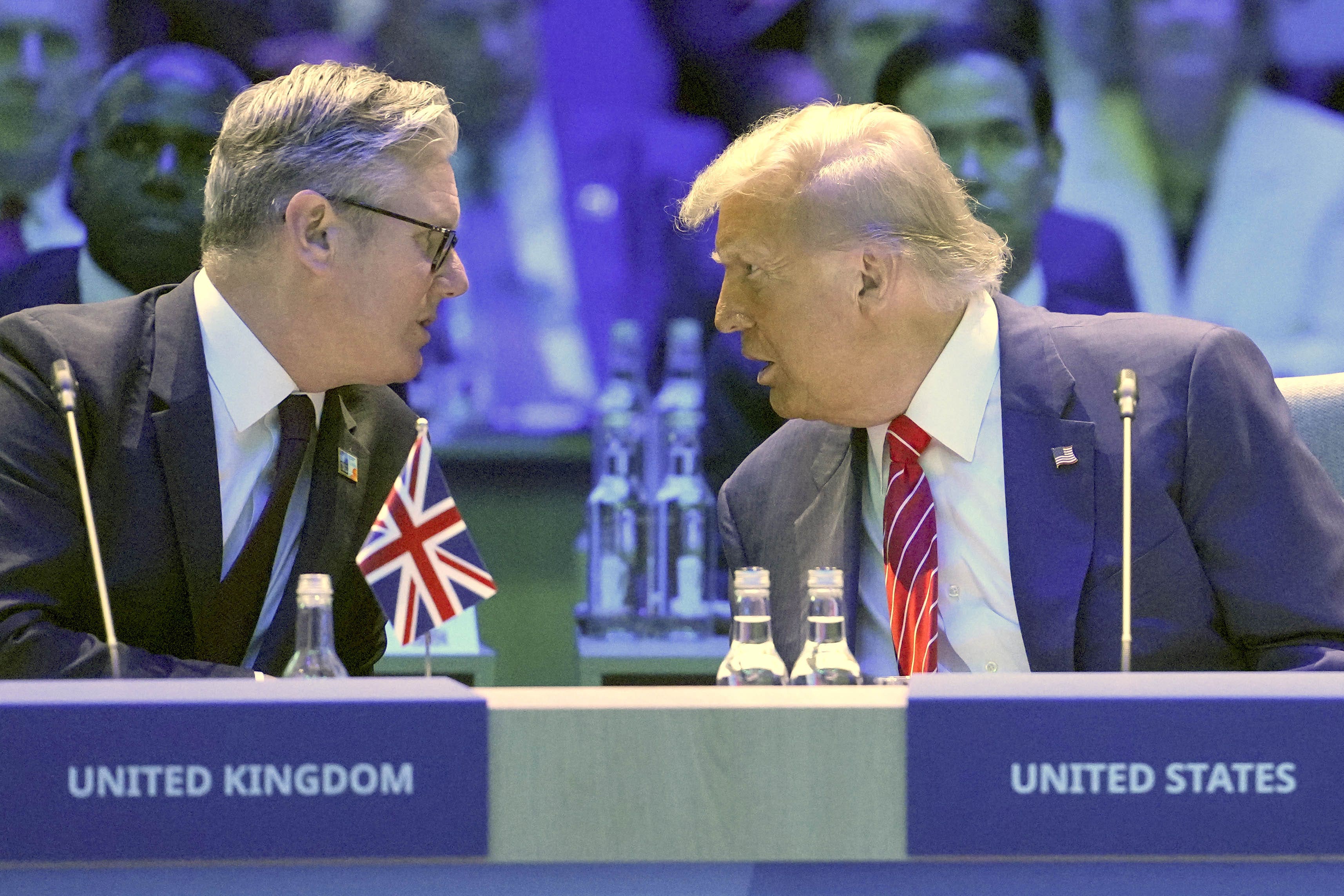 Prime Minister Sir Keir Starmer speaks with US President Donald Trump before the start of a North Atlantic Council plenary meeting during the Nato Summit at the Hague, Netherlands (Kin Cheung/PA)