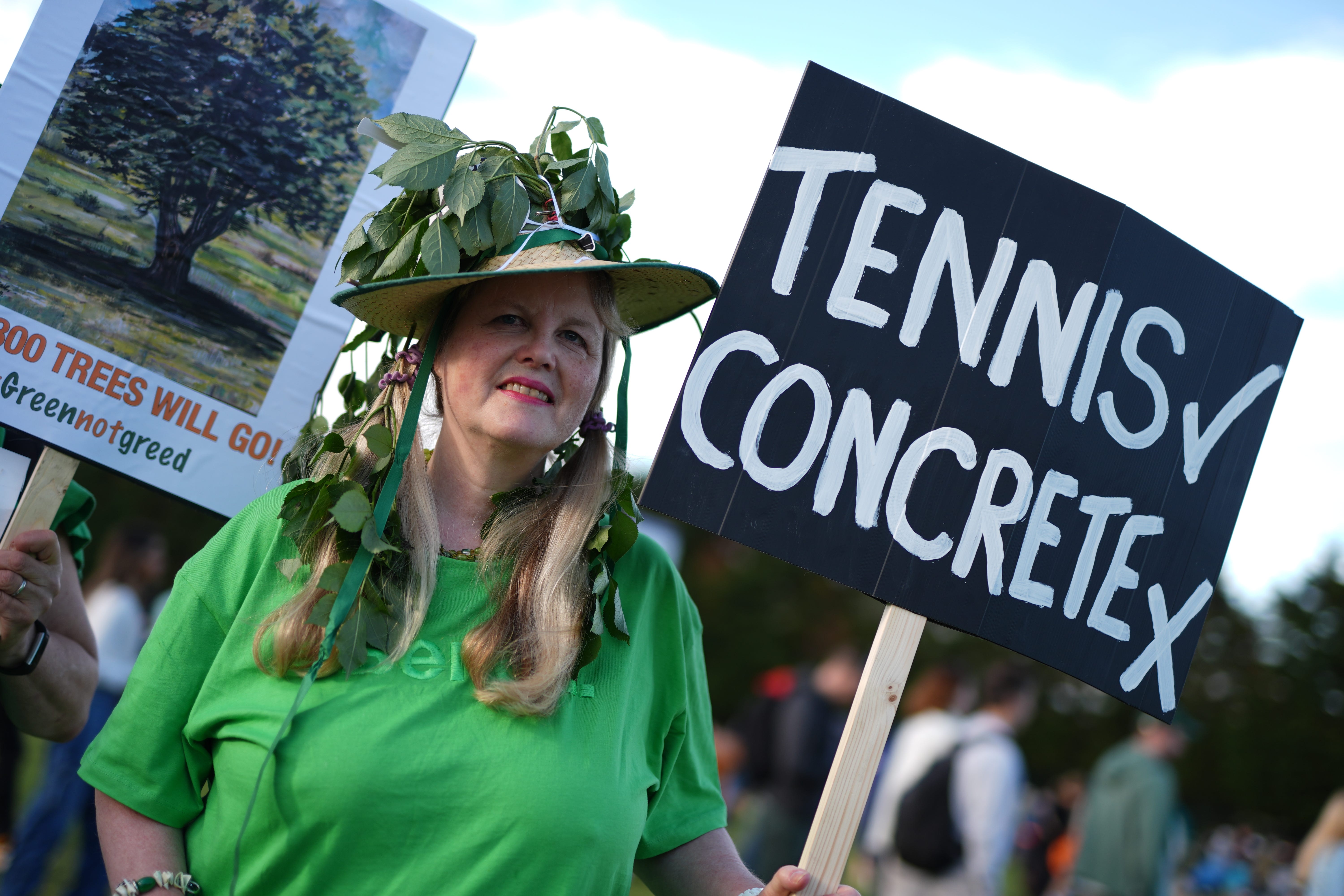 A woman protesting against the expansion of Wimbledon at the start of the tournament last year (Jordan Pettitt/PA)