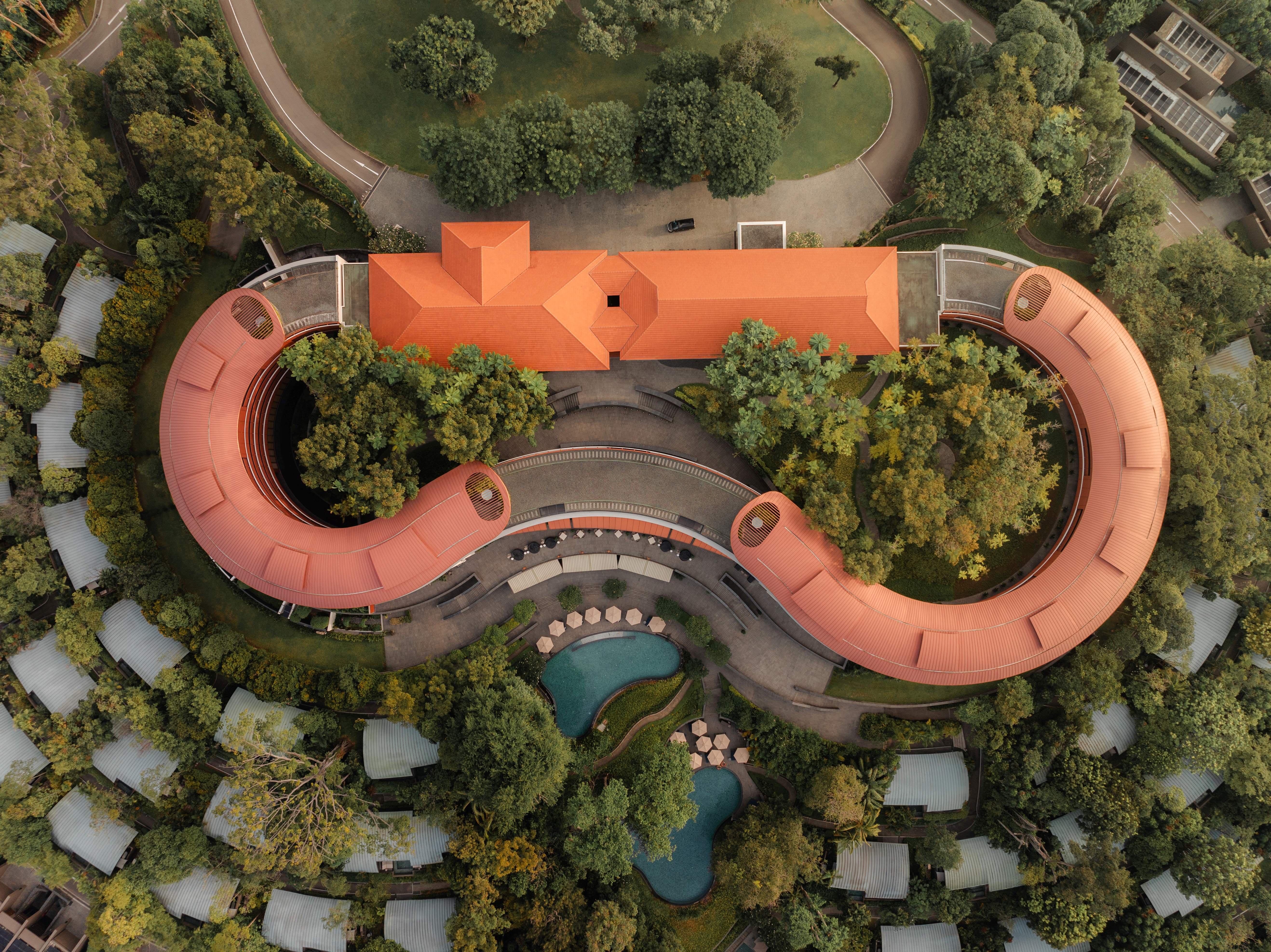 The pool area at Capella Singapore is tucked away between the greenery of the hotel grounds