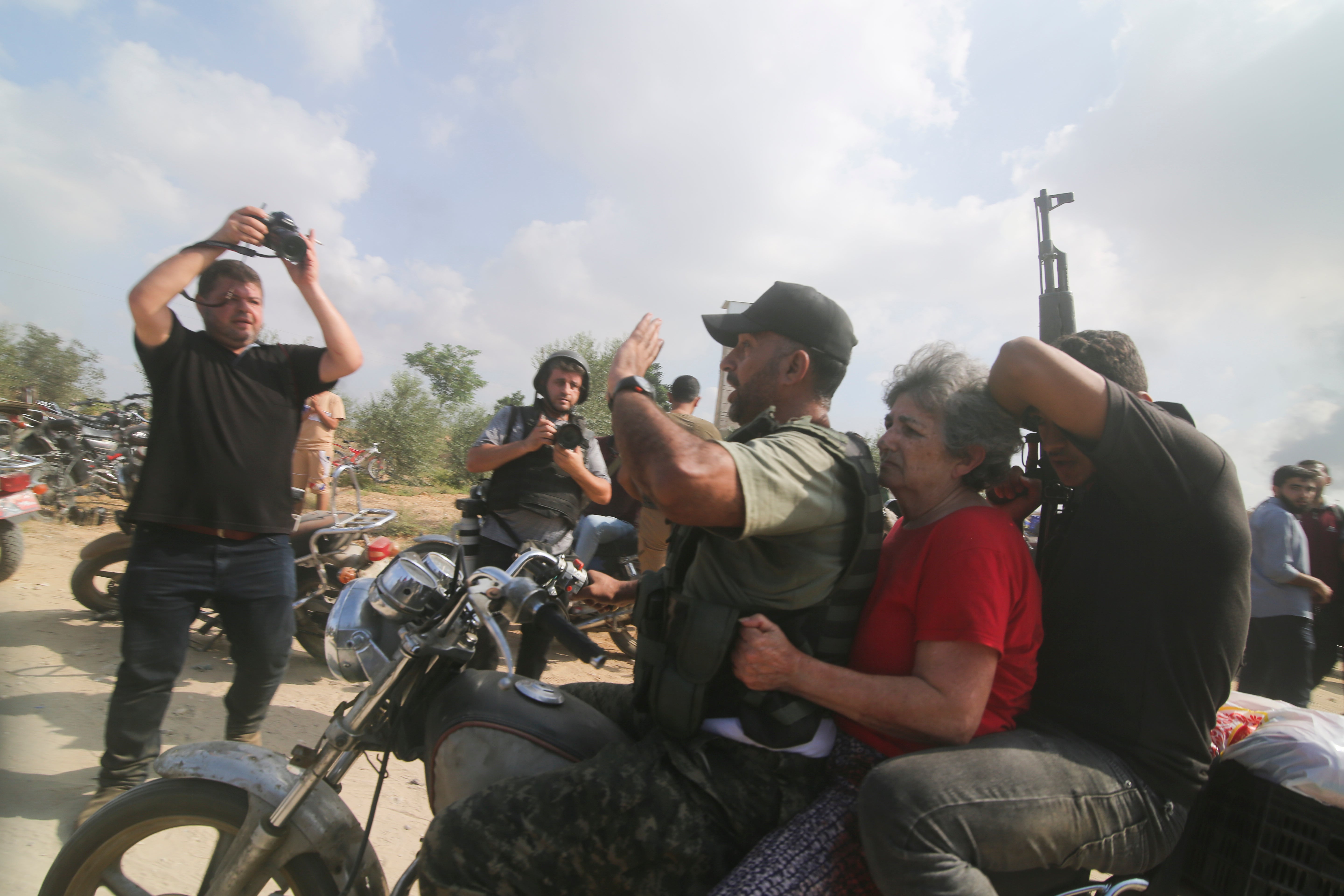 Hamas militants transport Adina Moshe, 72, inside the Gaza Strip after kidnapping her from her home in Nir Oz, a kibbutz in Israel near the Gaza border, on 7 October 2023