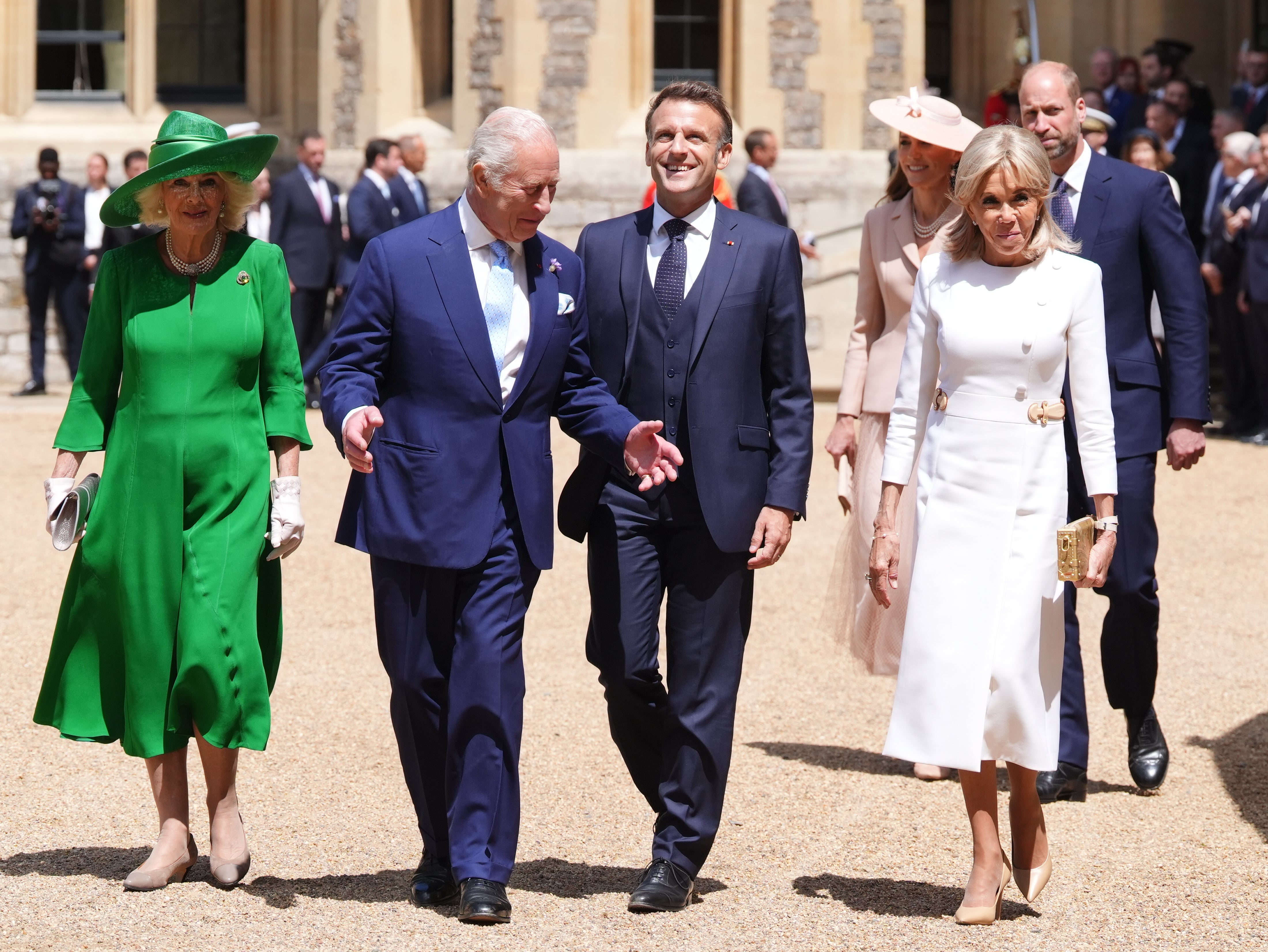 Queen Camilla and King Charles walk alongside the Macrons at the ceremonial welcome for the French president’s state visit to the UK at Windsor Castle
