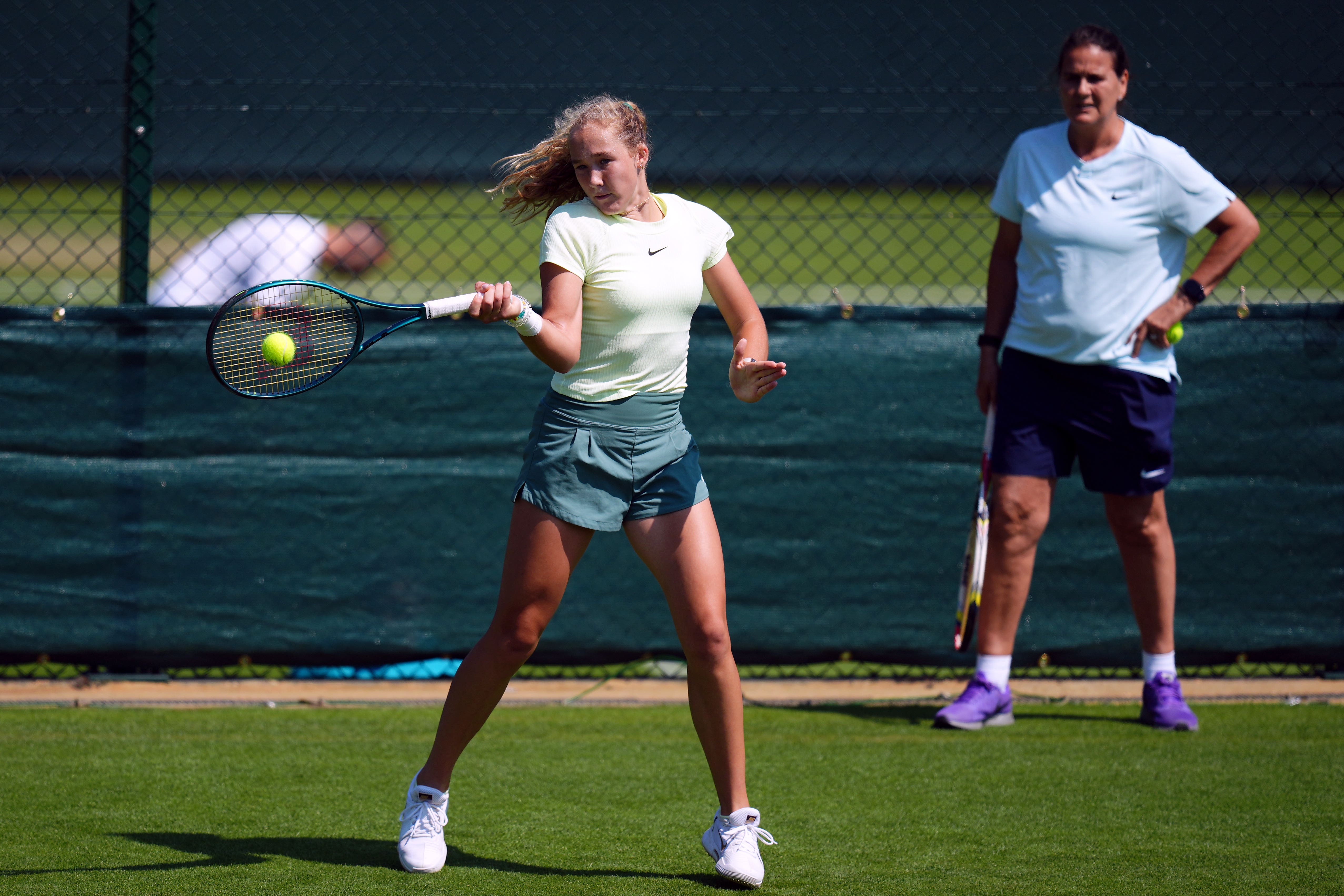 Mirra Andreeva practises under the eye of coach Conchita Martinez (John Walton/PA)