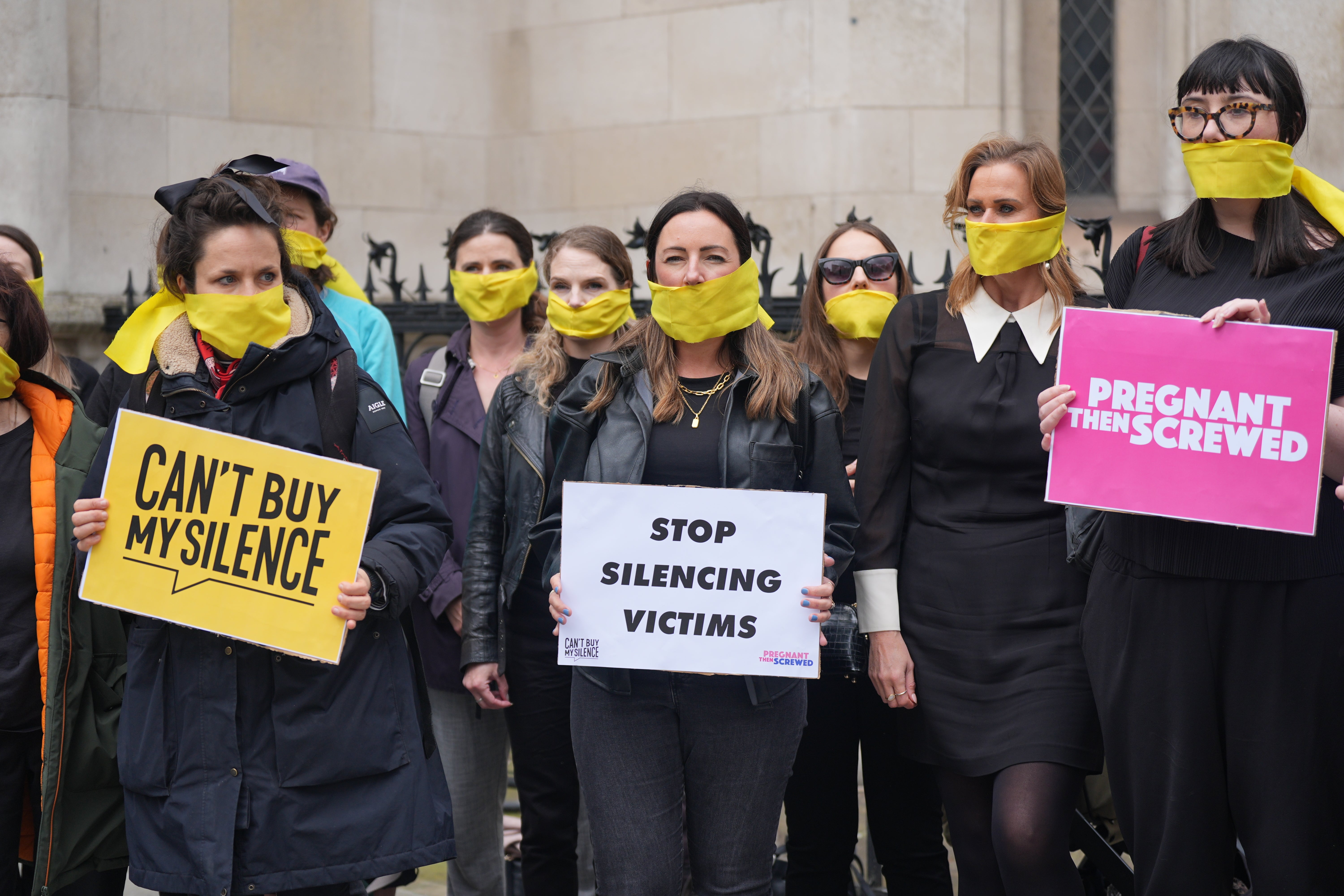 Campaigners from Can't Buy My Silence holding a protest outside the Royal Courts of Justice last year