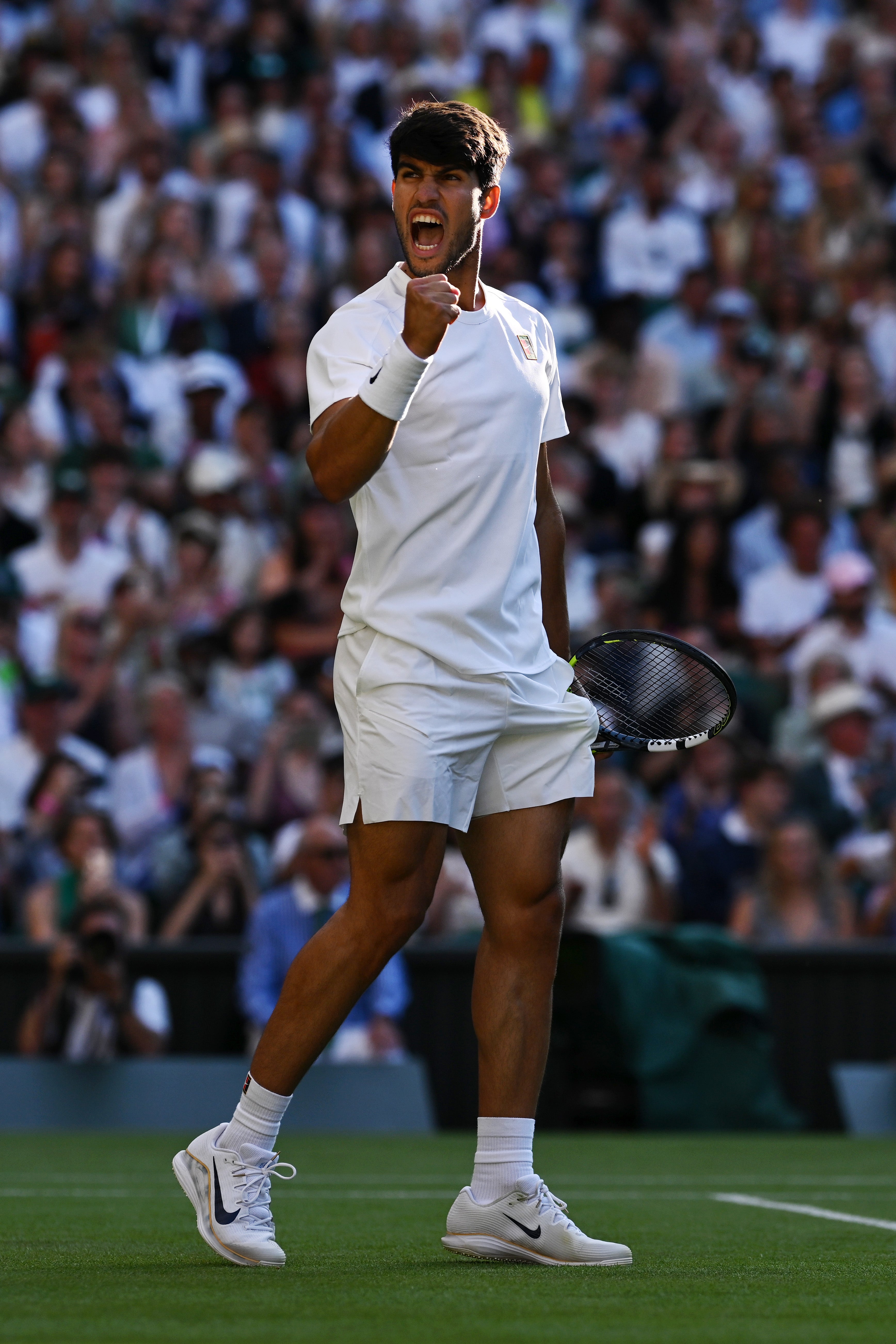 Carlos Alcaraz celebrates beating Cameron Norrie in the Wimbledon quarter-finals