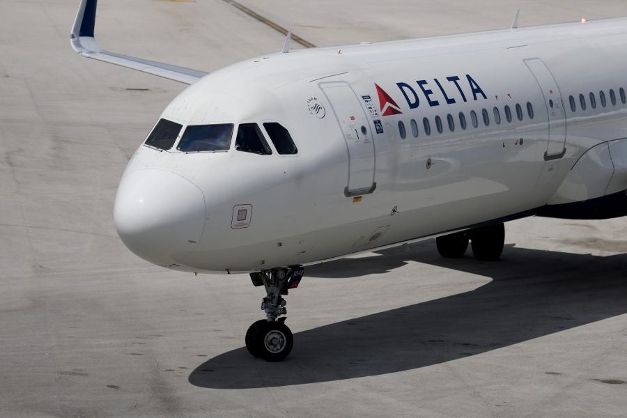 According to Delta, flight attendants put out a personal device and the flight was diverted as a precaution.