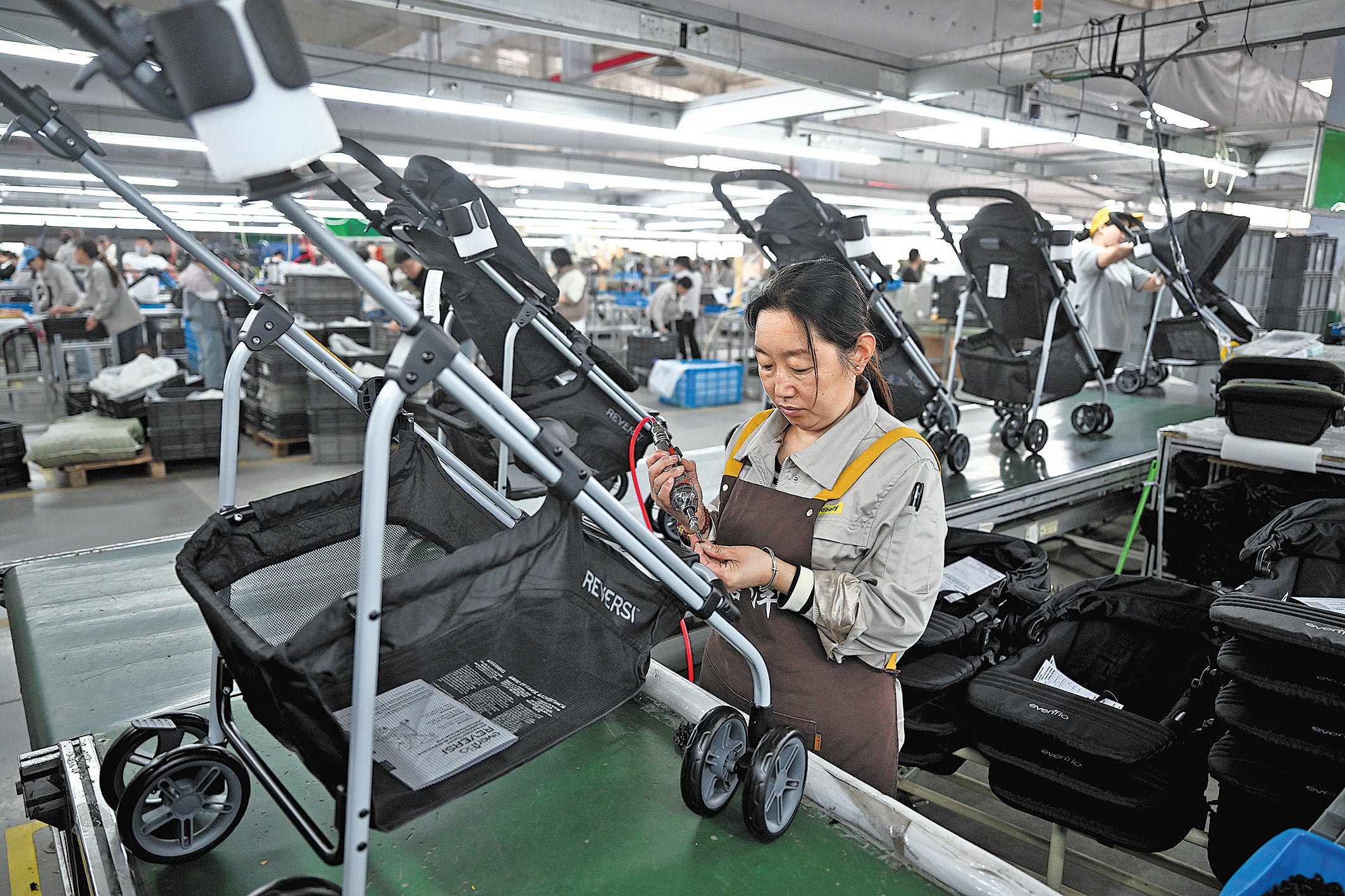 Finishing touches are made to baby strollers on an assembly line in Pingxiang in April