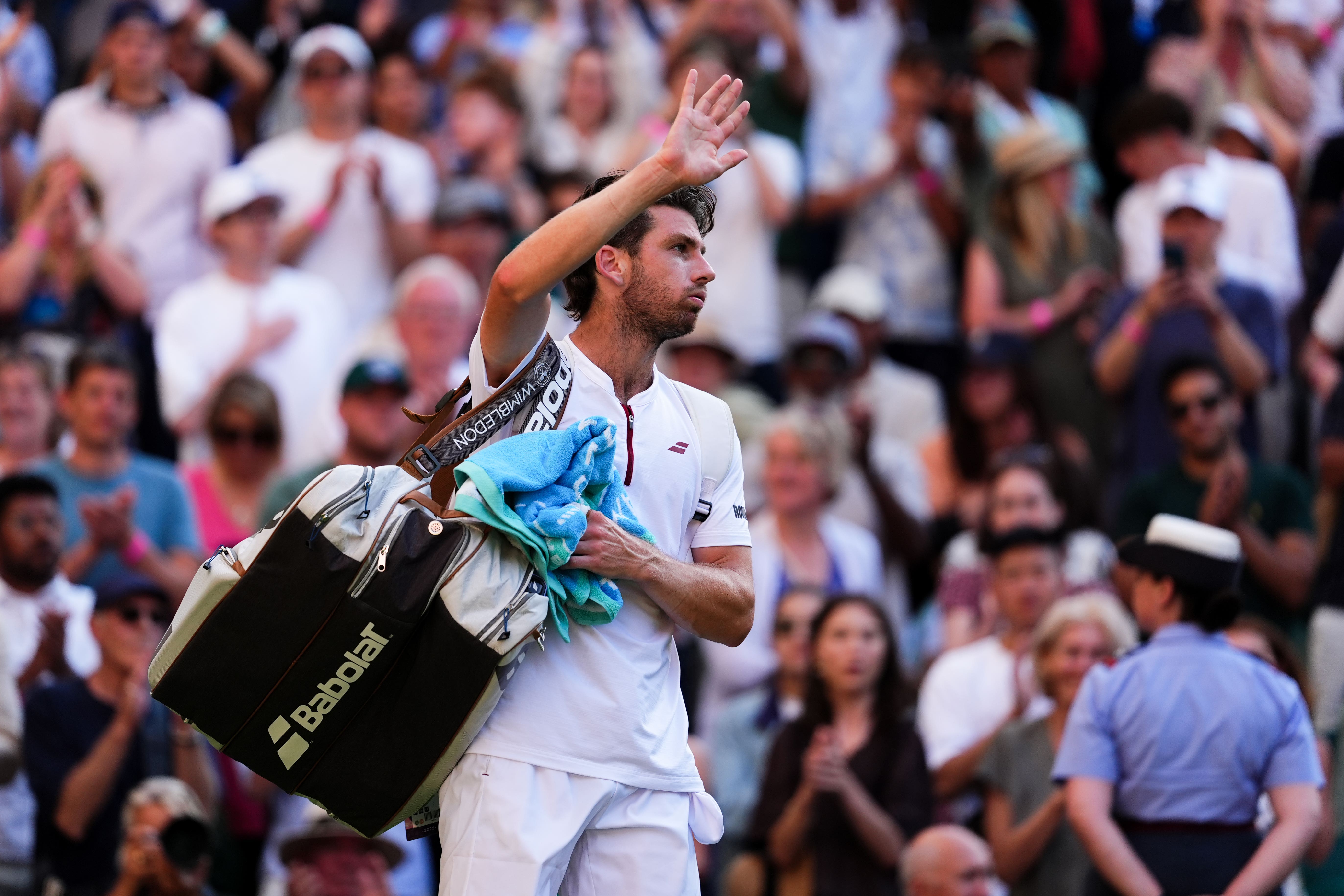 Cameron Norrie waves goodbye to Wimbledon