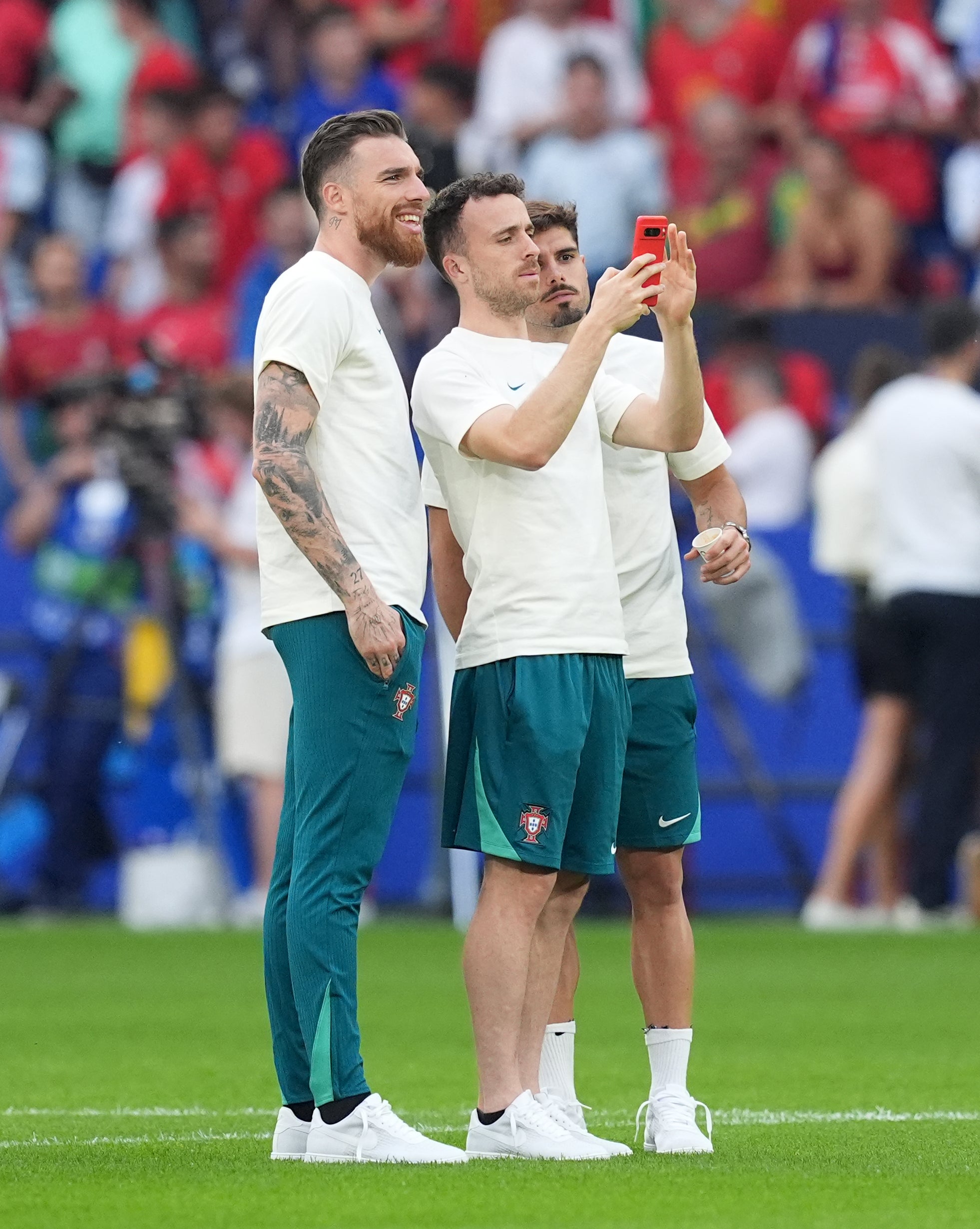 Neto (right) and Jota (centre) were international team-mates and friends (Martin Rickett/PA)