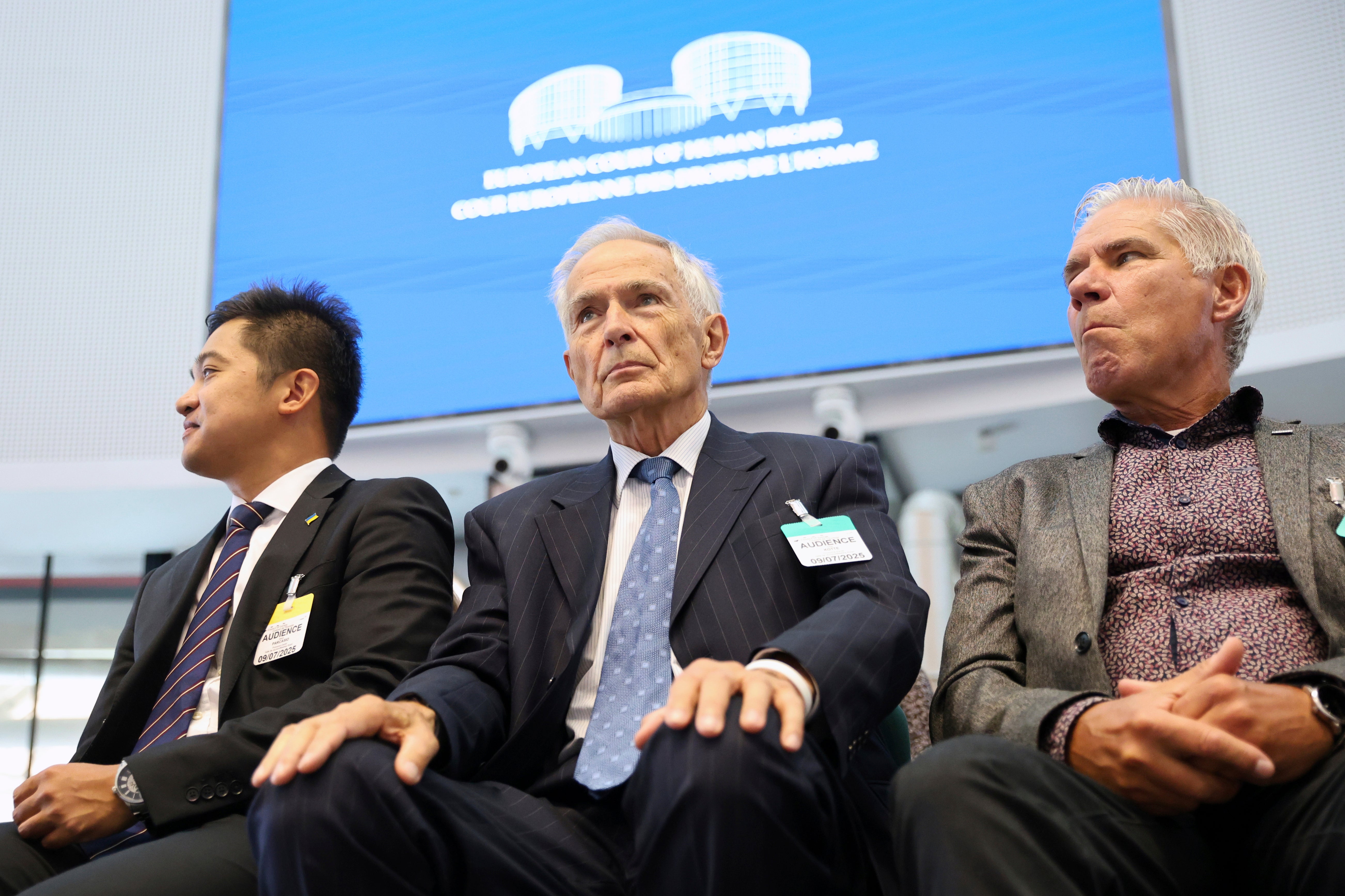Netherland's Anton Kotte, center, who lost his son and other family members in the the downing of Malaysia Airlines flight MH17